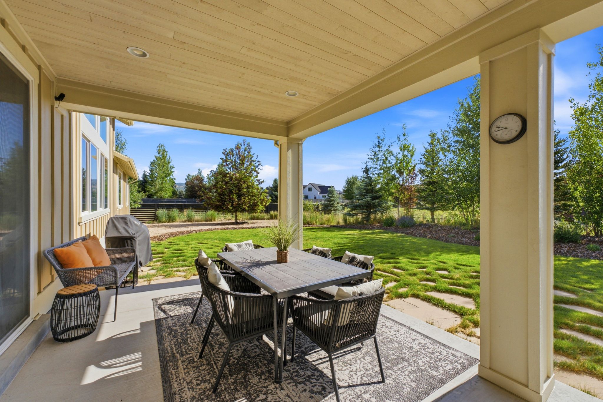 Covered patio with a natural wood-finish ceiling