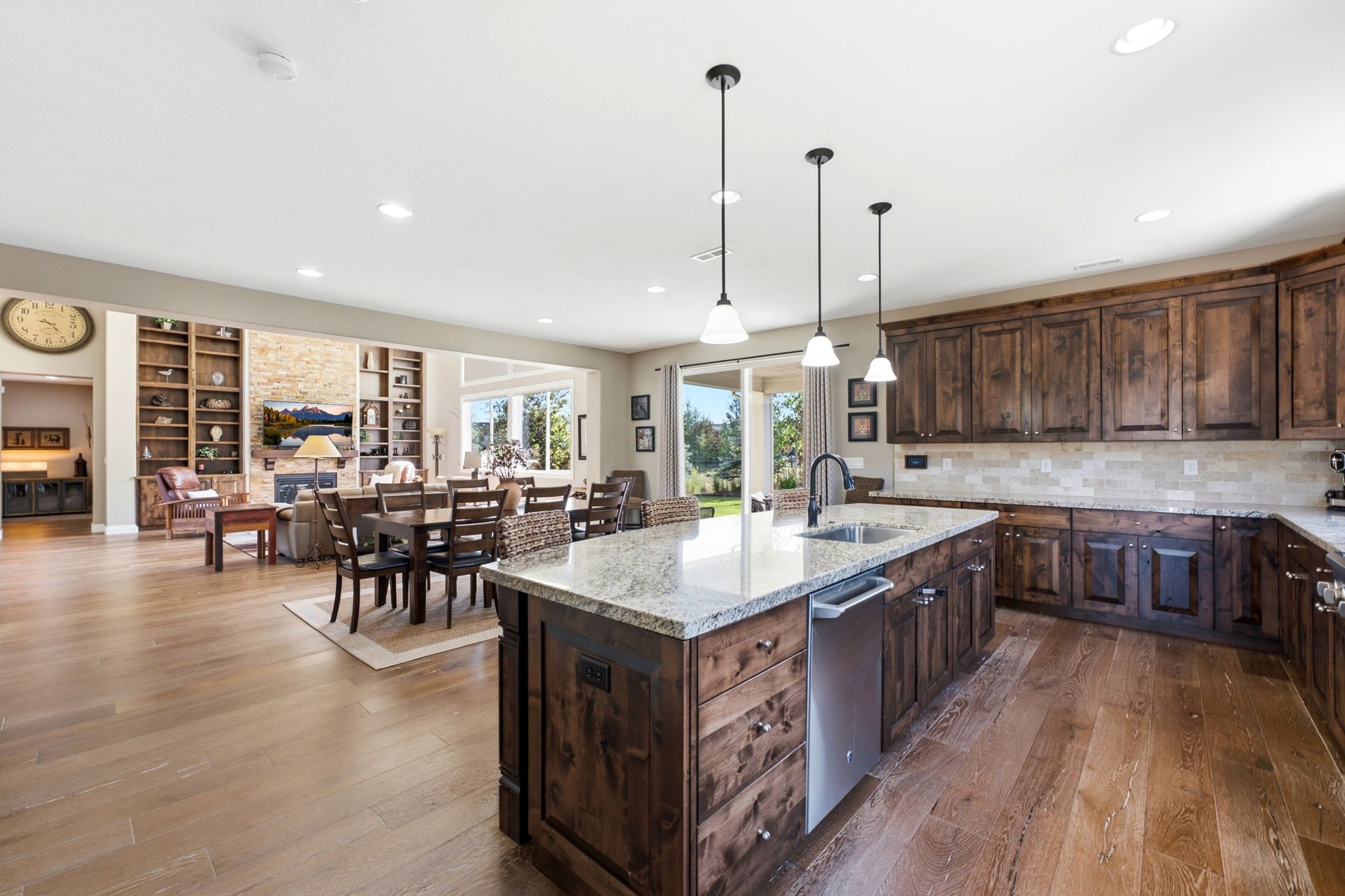 Open-concept living space featuring wood-finish flooring throughout