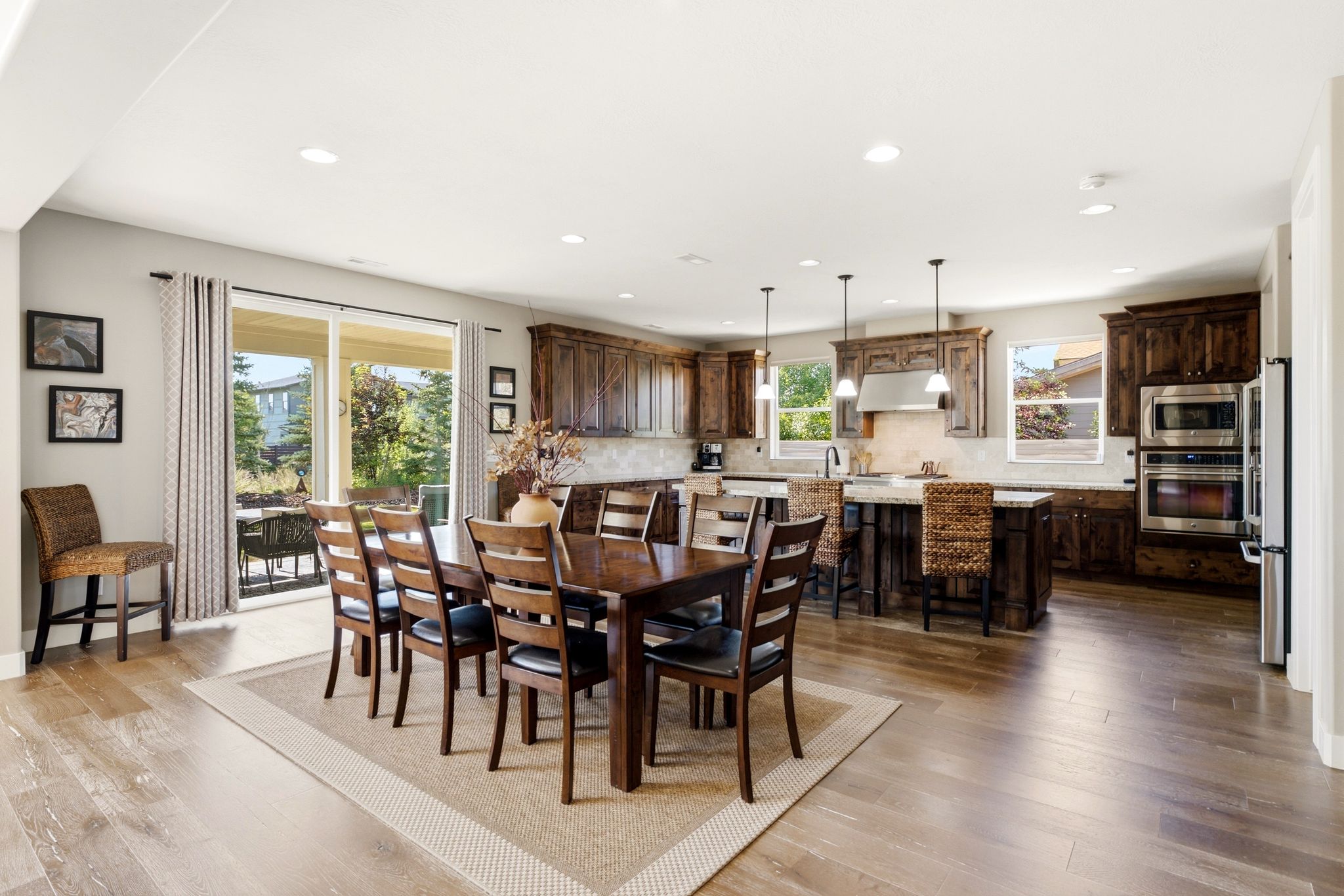 Open-concept living space with wood-finish flooring