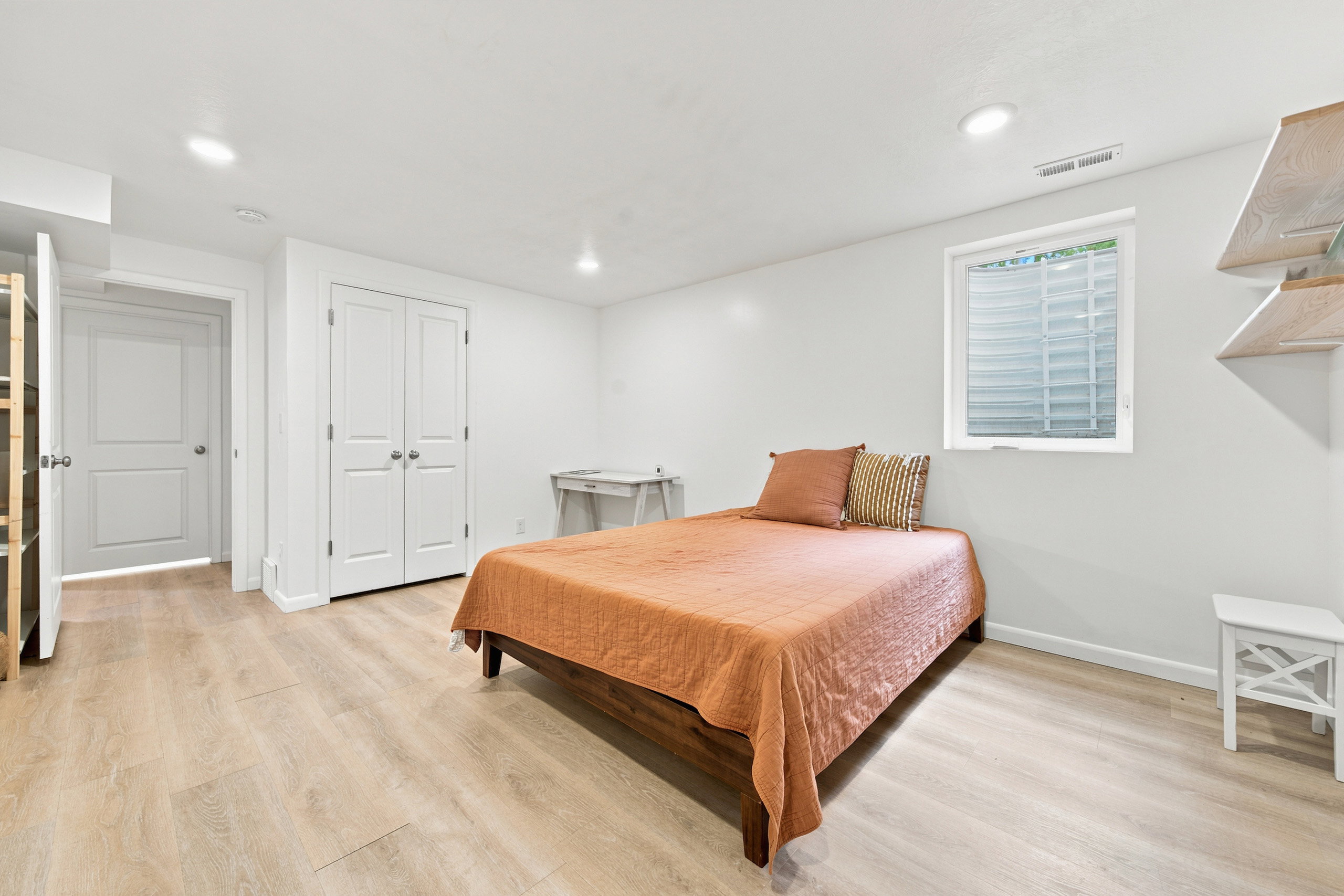 Bedroom featuring light wood-finish flooring and recessed lighting