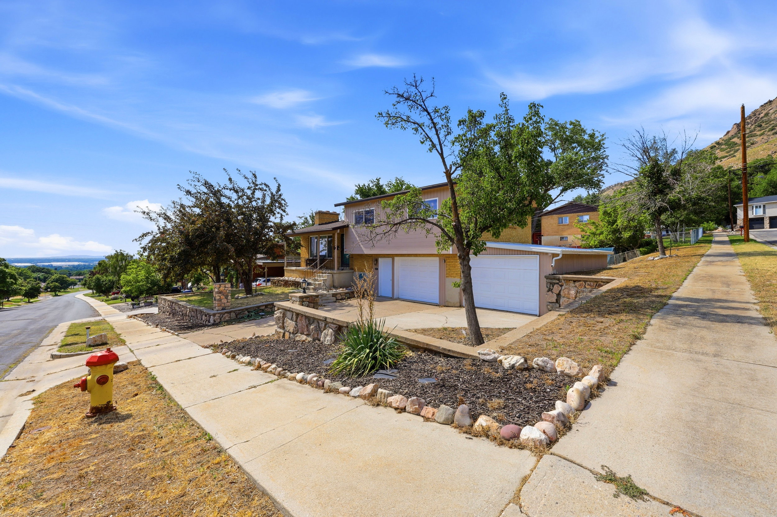 Split-level residential property with a two-car garage