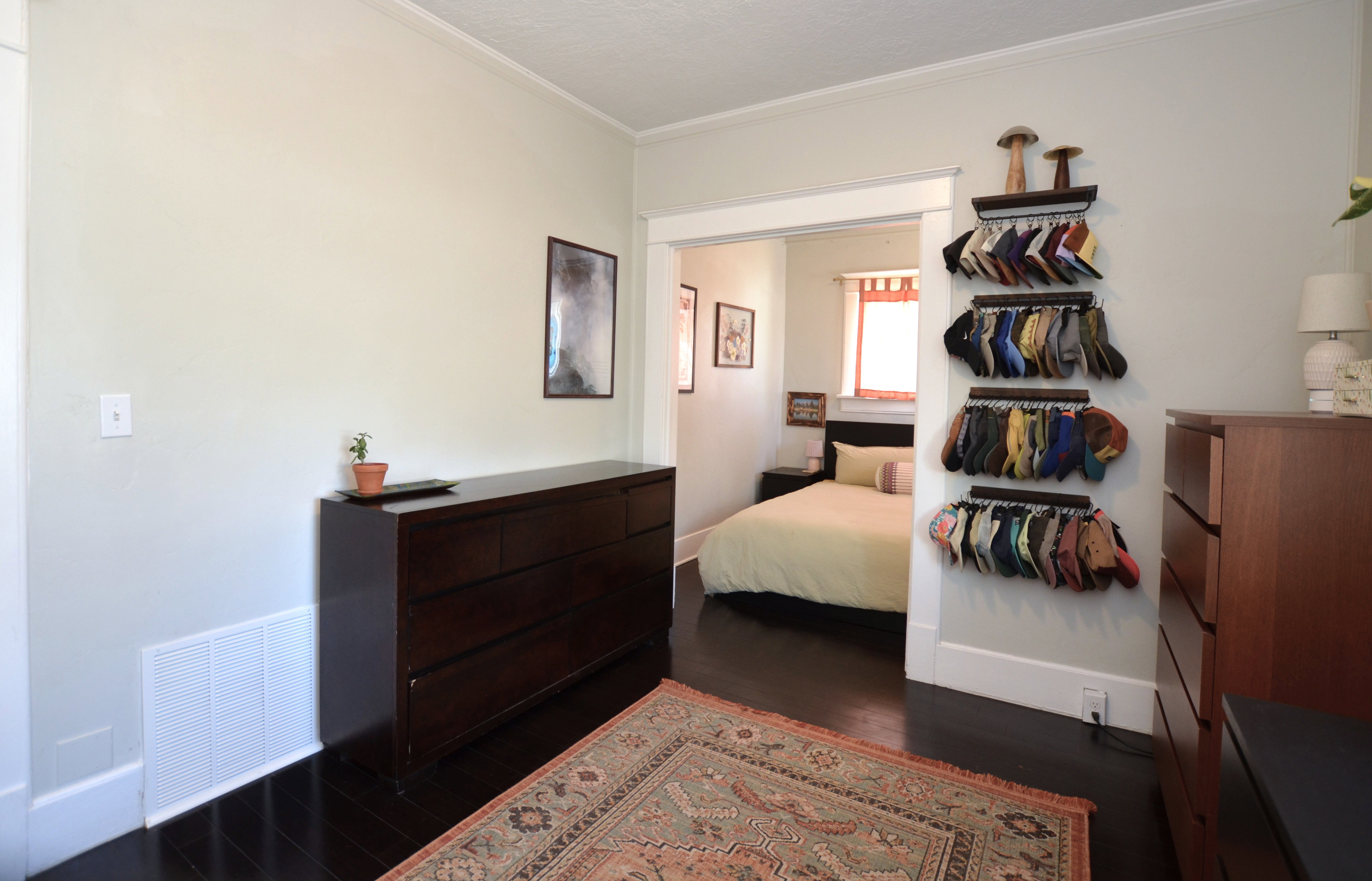 Interior room with dark wood-finish flooring and light-toned walls
