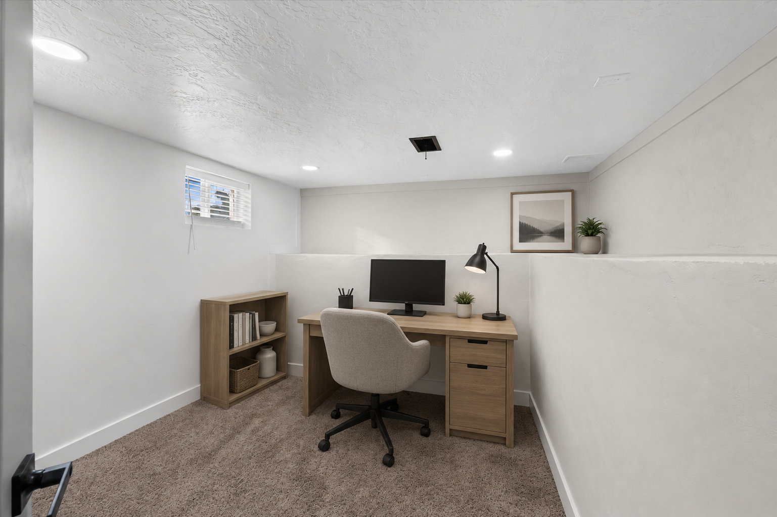 Dedicated workspace featuring recessed lighting and a window with blinds