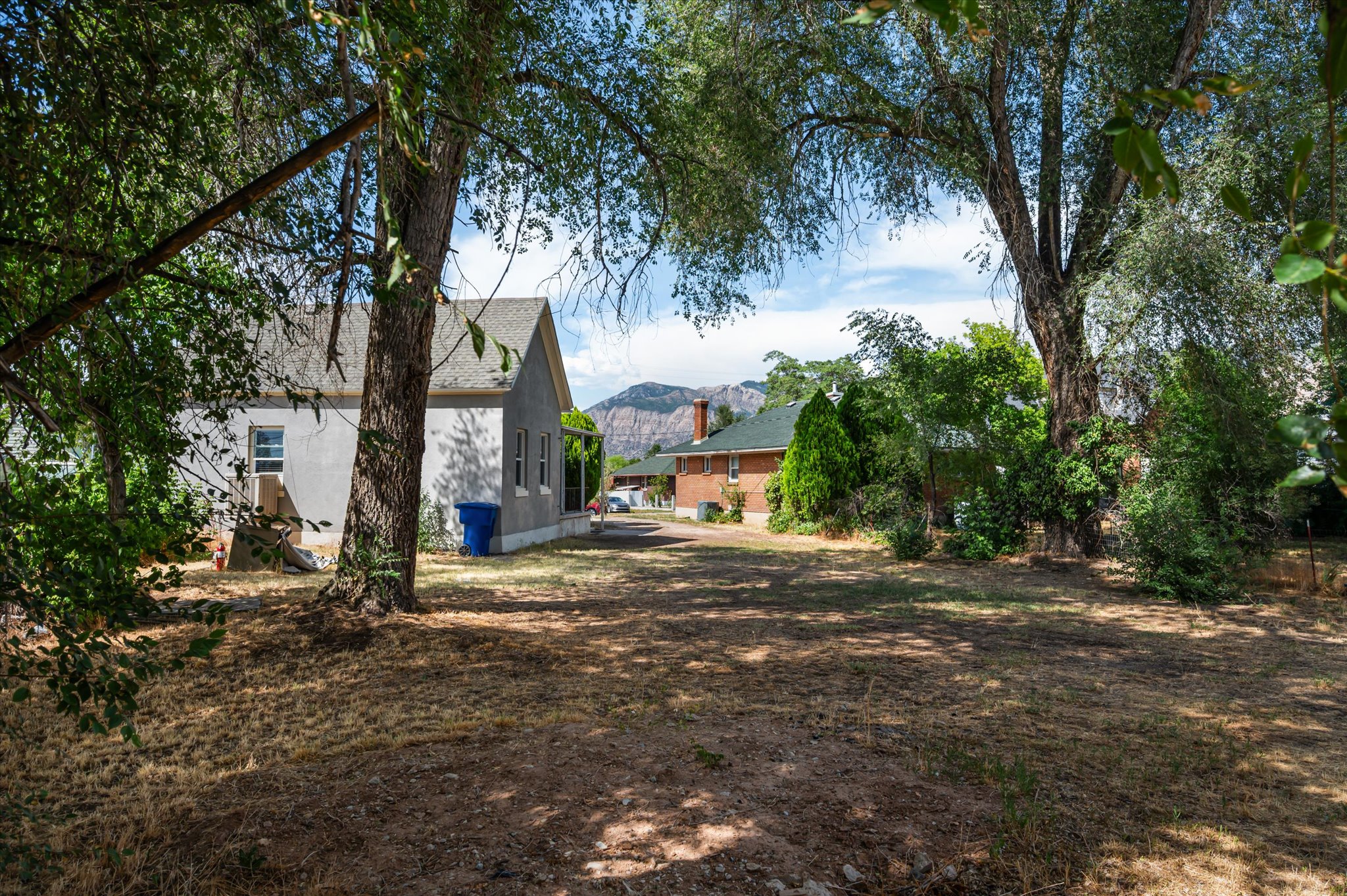 Expansive property featuring mature trees and a substantial yard space