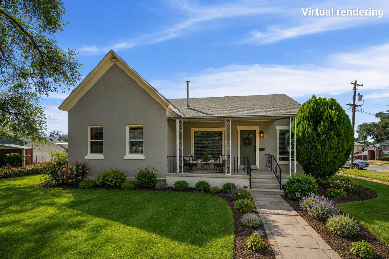 Stucco exterior featuring a covered porch with decorative railings, a front entry door with transom window, and a stone-paved walkway