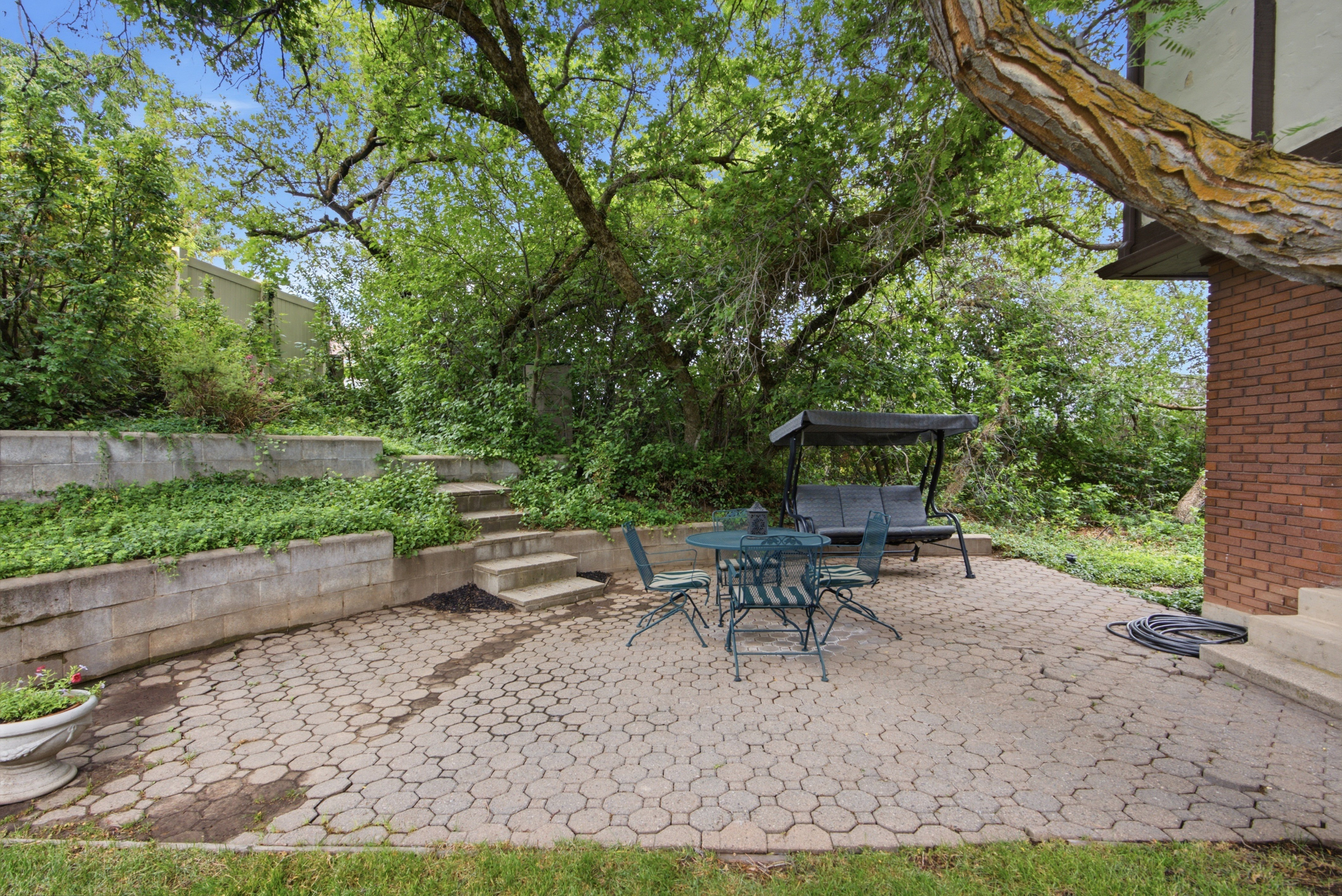 Paver patio with terraced landscaping features