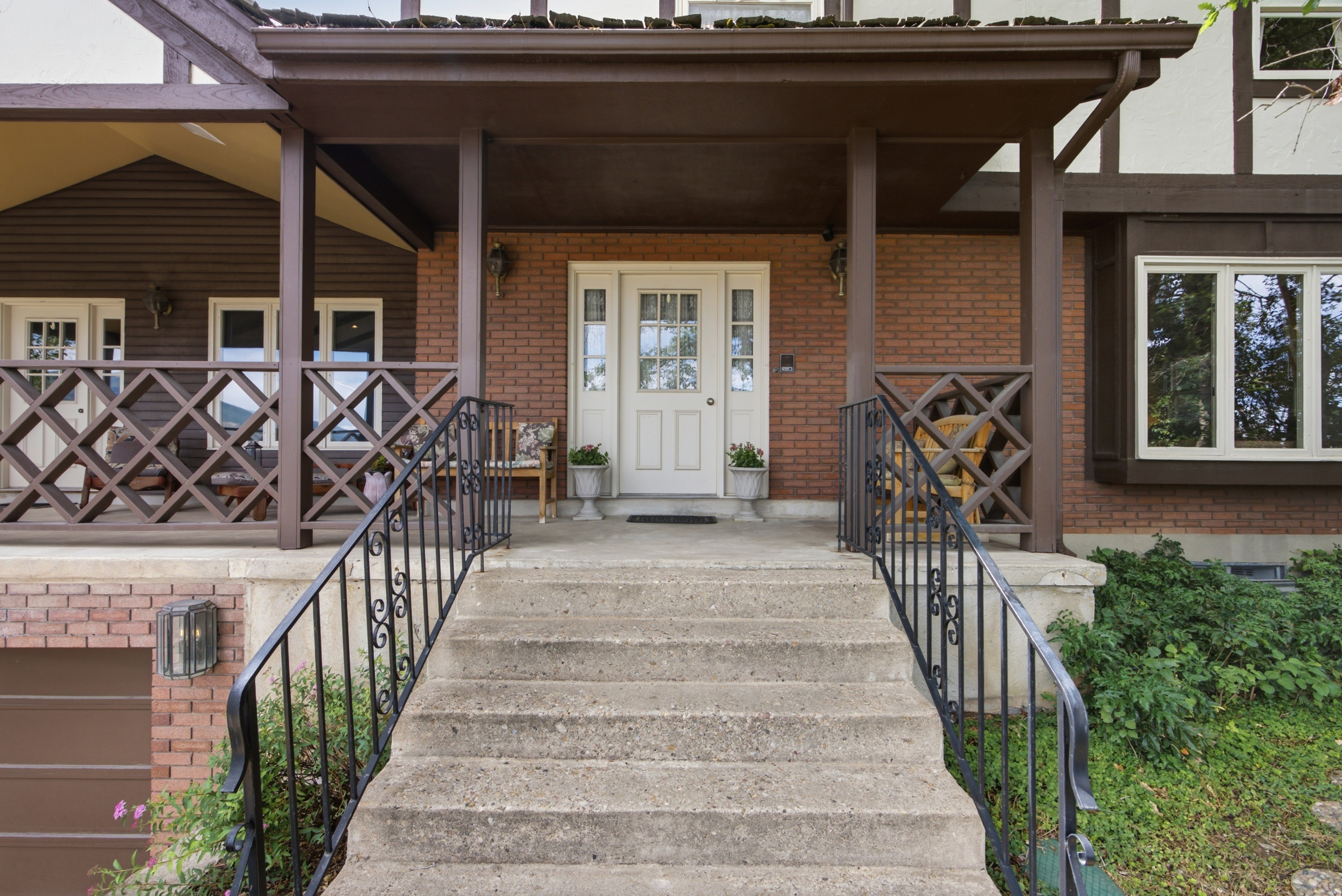 Brick facade with a covered porch entry