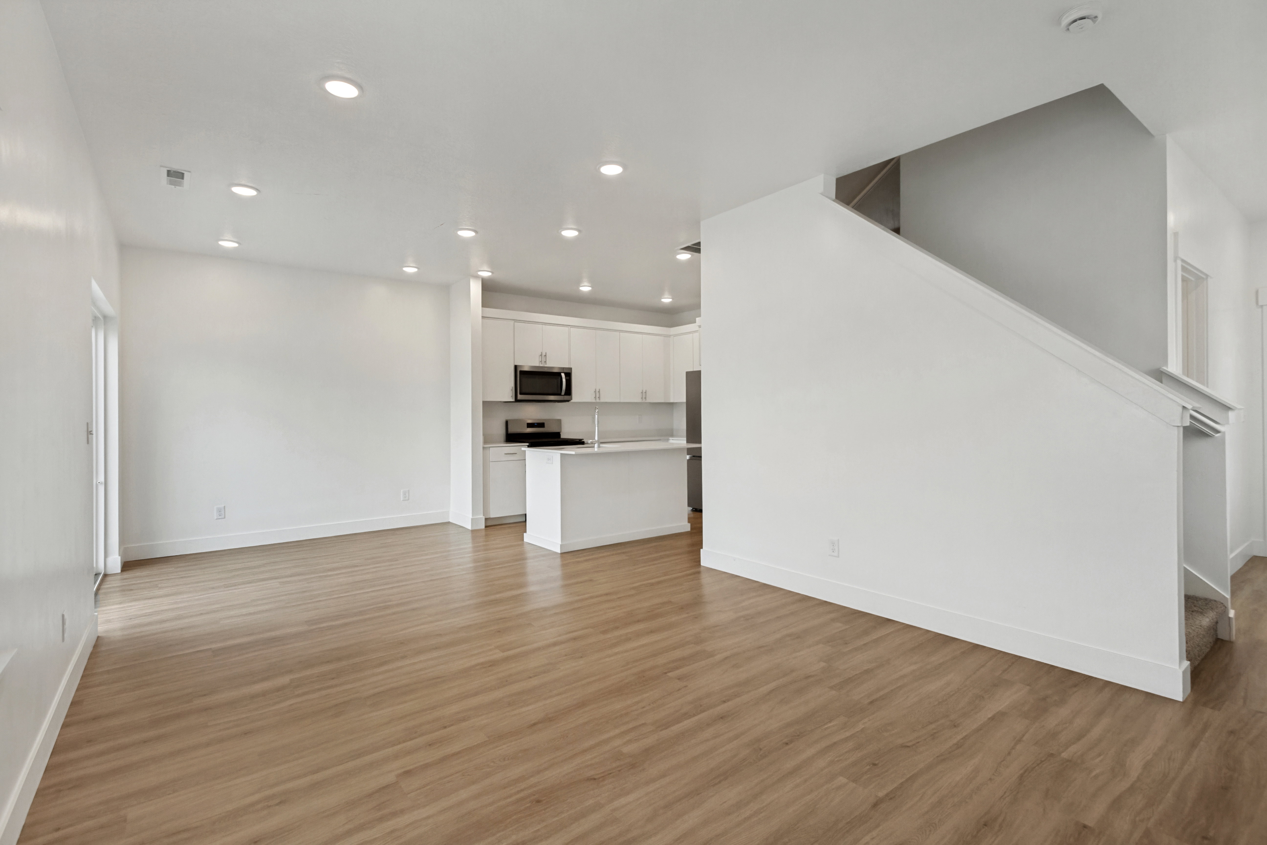 Living room with recessed lighting and natural light