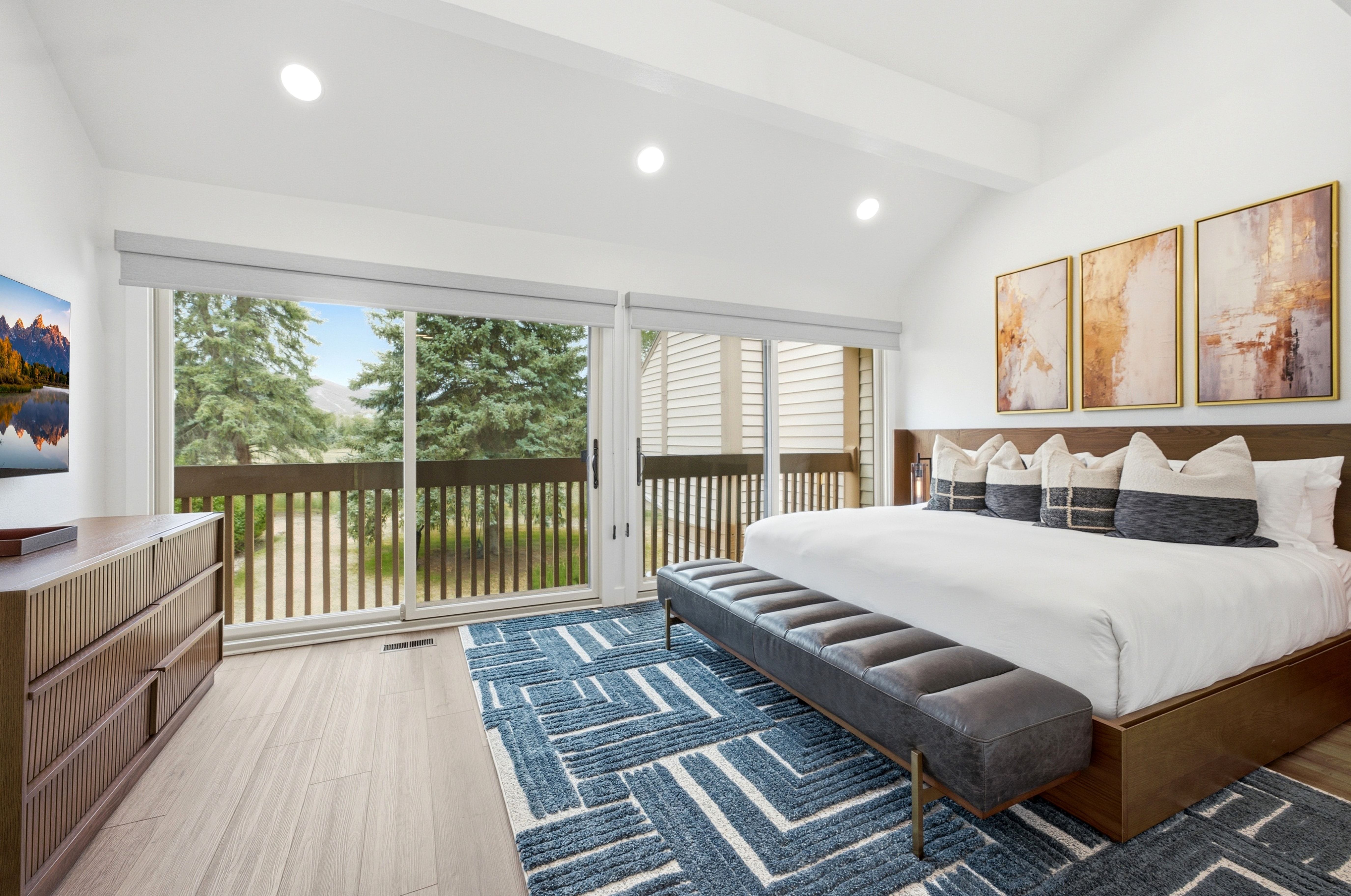 Vaulted ceiling room featuring light wood-finish flooring and recessed lighting