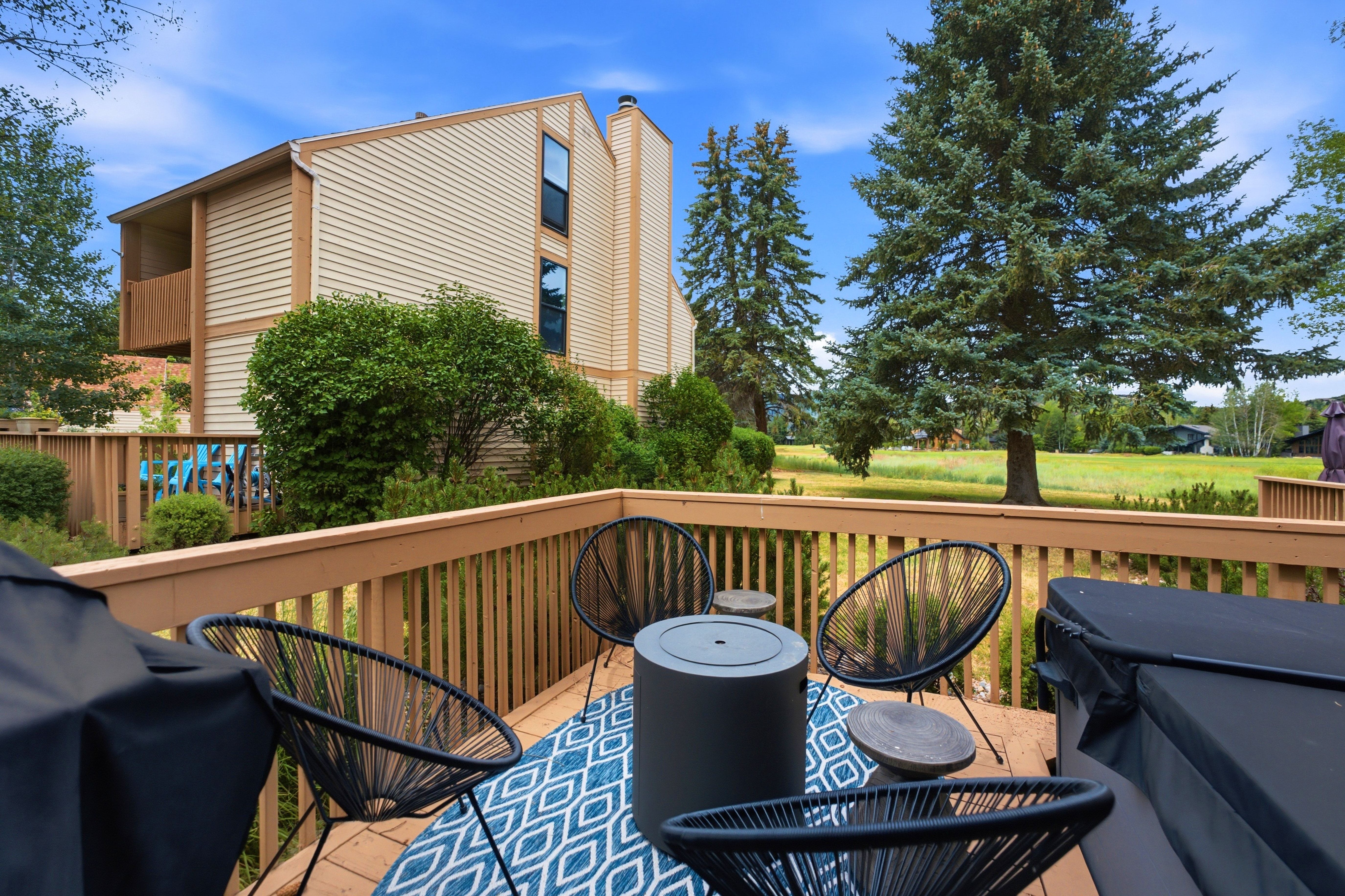 Expansive wood deck with natural wood railing, offering outdoor living space