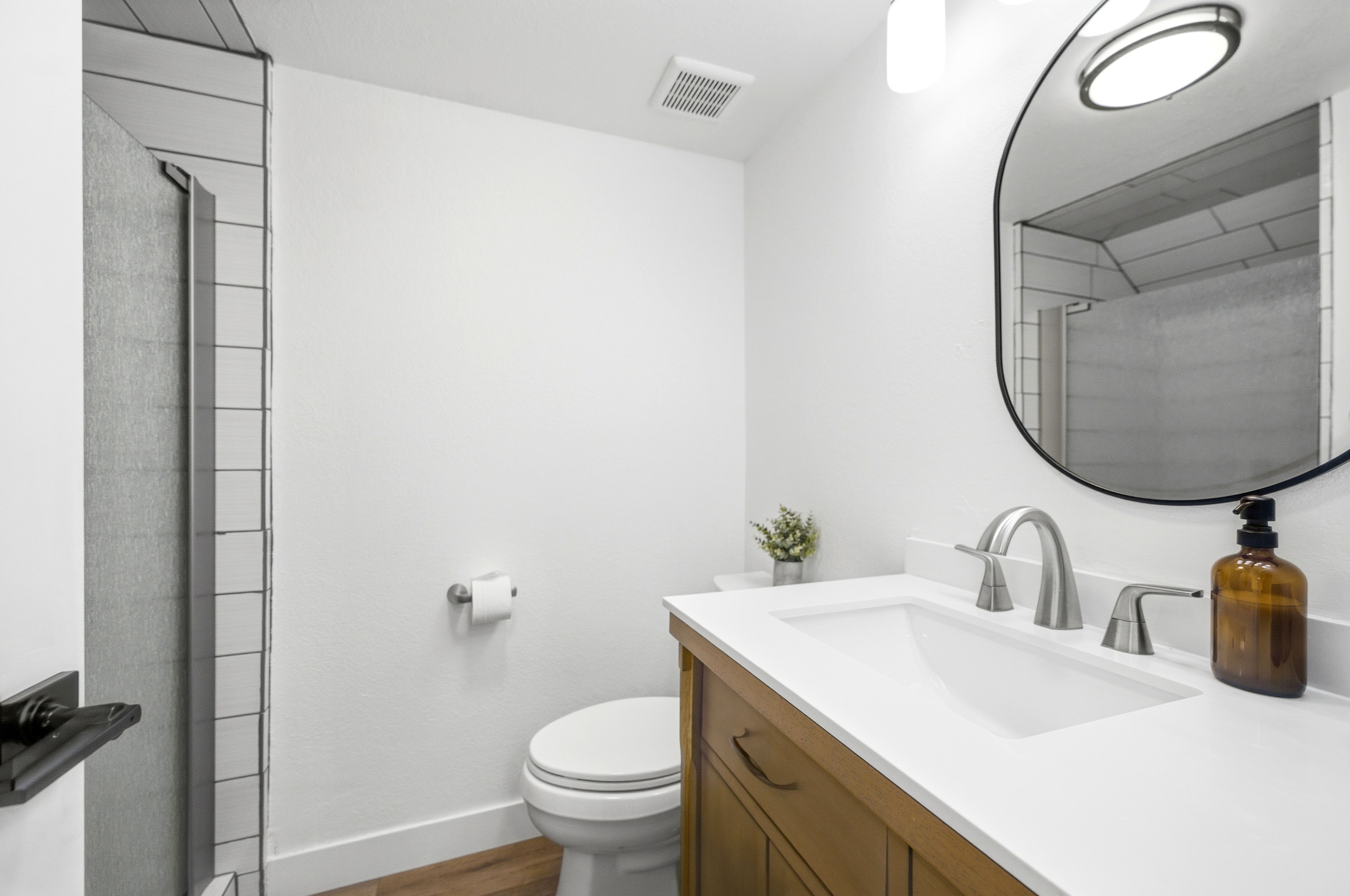Bathroom vanity with a white countertop and undermount sink