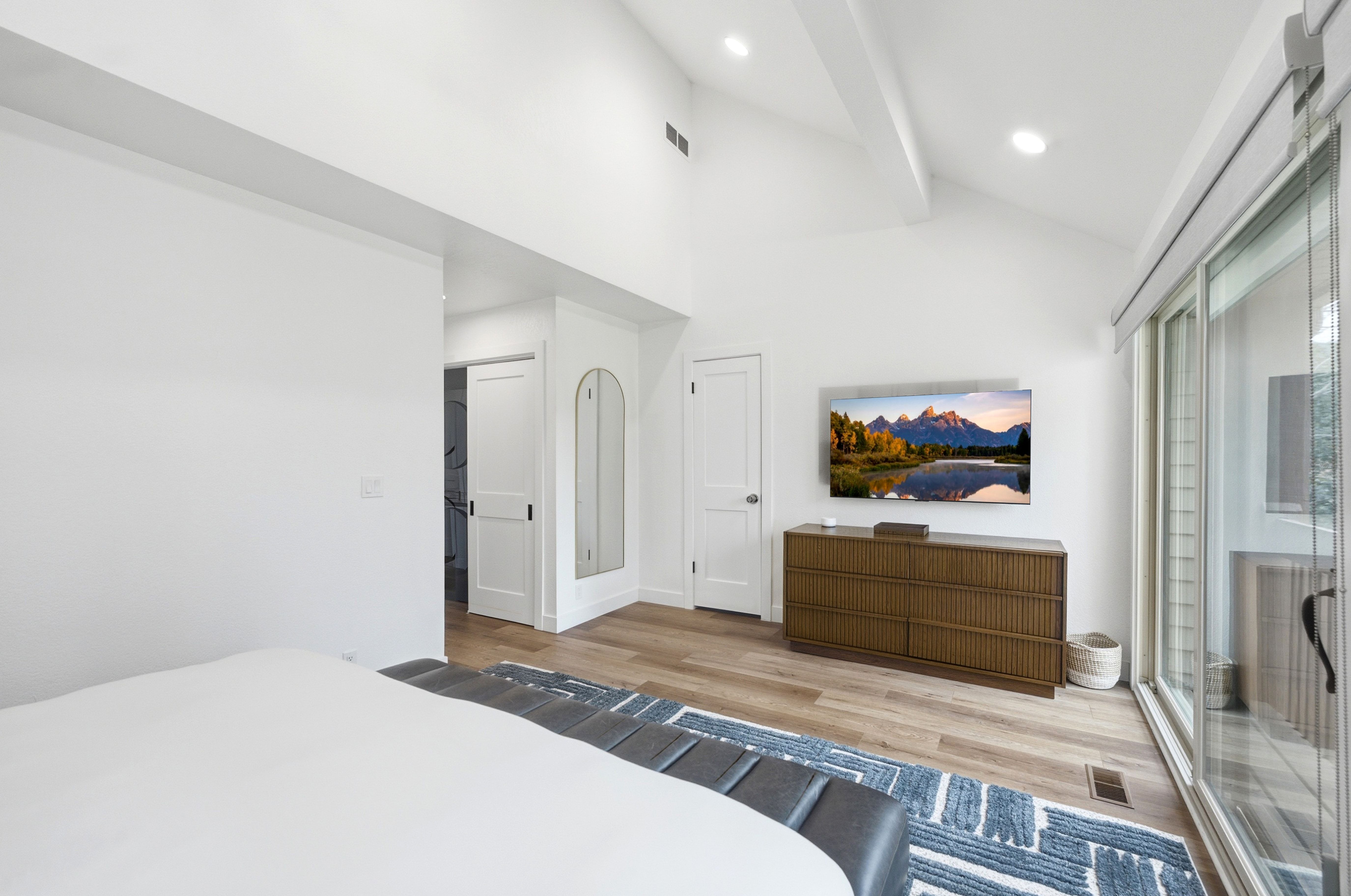 Vaulted ceilings with exposed beams and recessed lighting