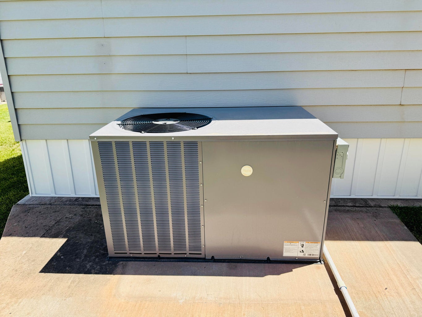 Exterior air conditioning unit on a concrete pad