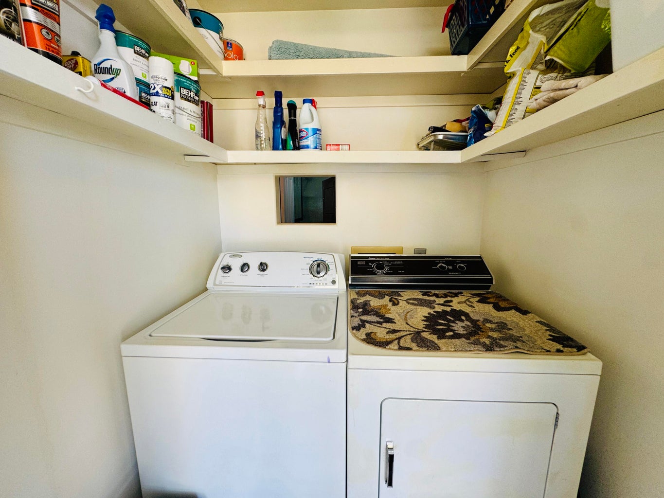 Dedicated laundry area featuring a built-in washing machine and dryer