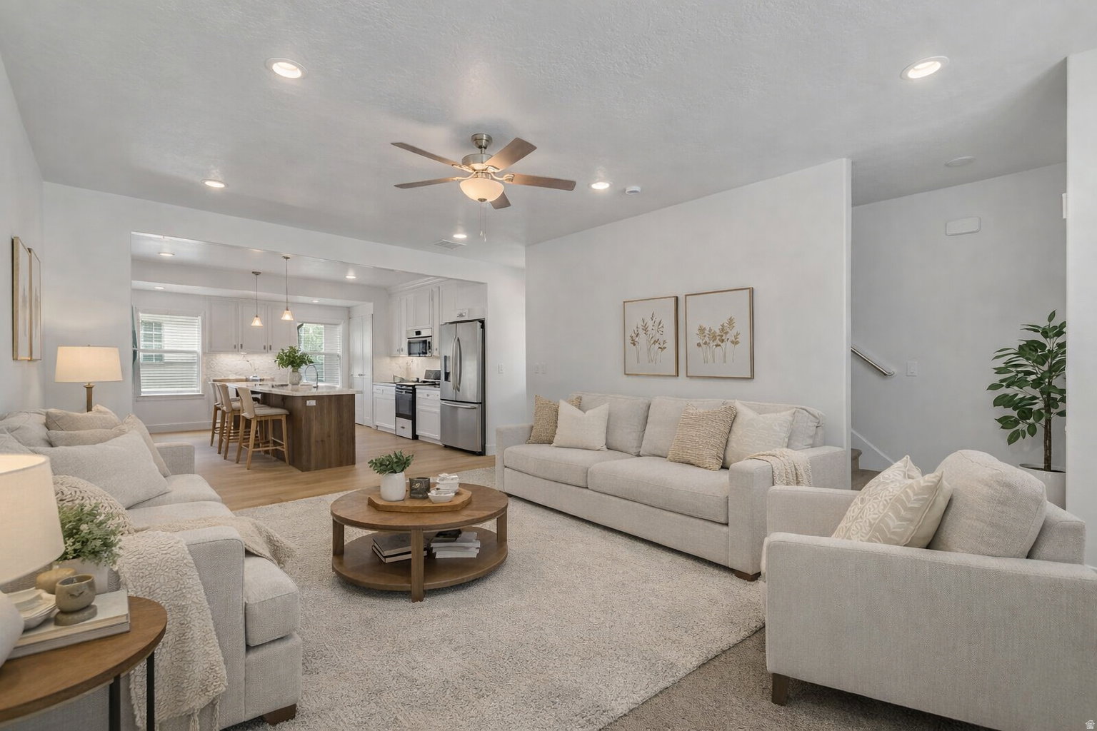 Open-concept living area featuring recessed lighting, a ceiling fan, and light-toned walls