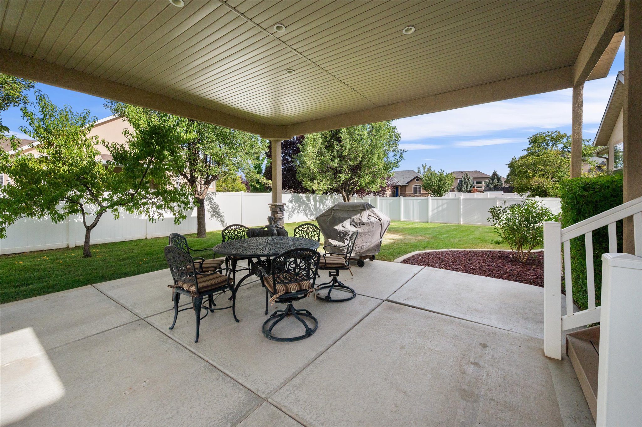 Covered patio with recessed lighting, concrete flooring, and a railing system