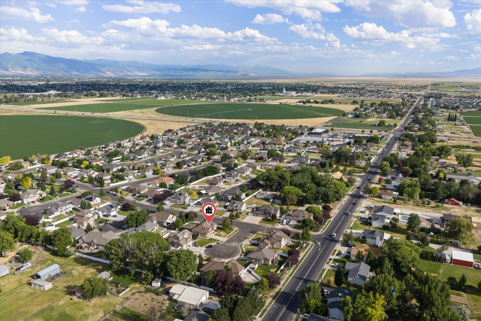 Aerial perspective showcasing a residential neighborhood with established homes and mature trees