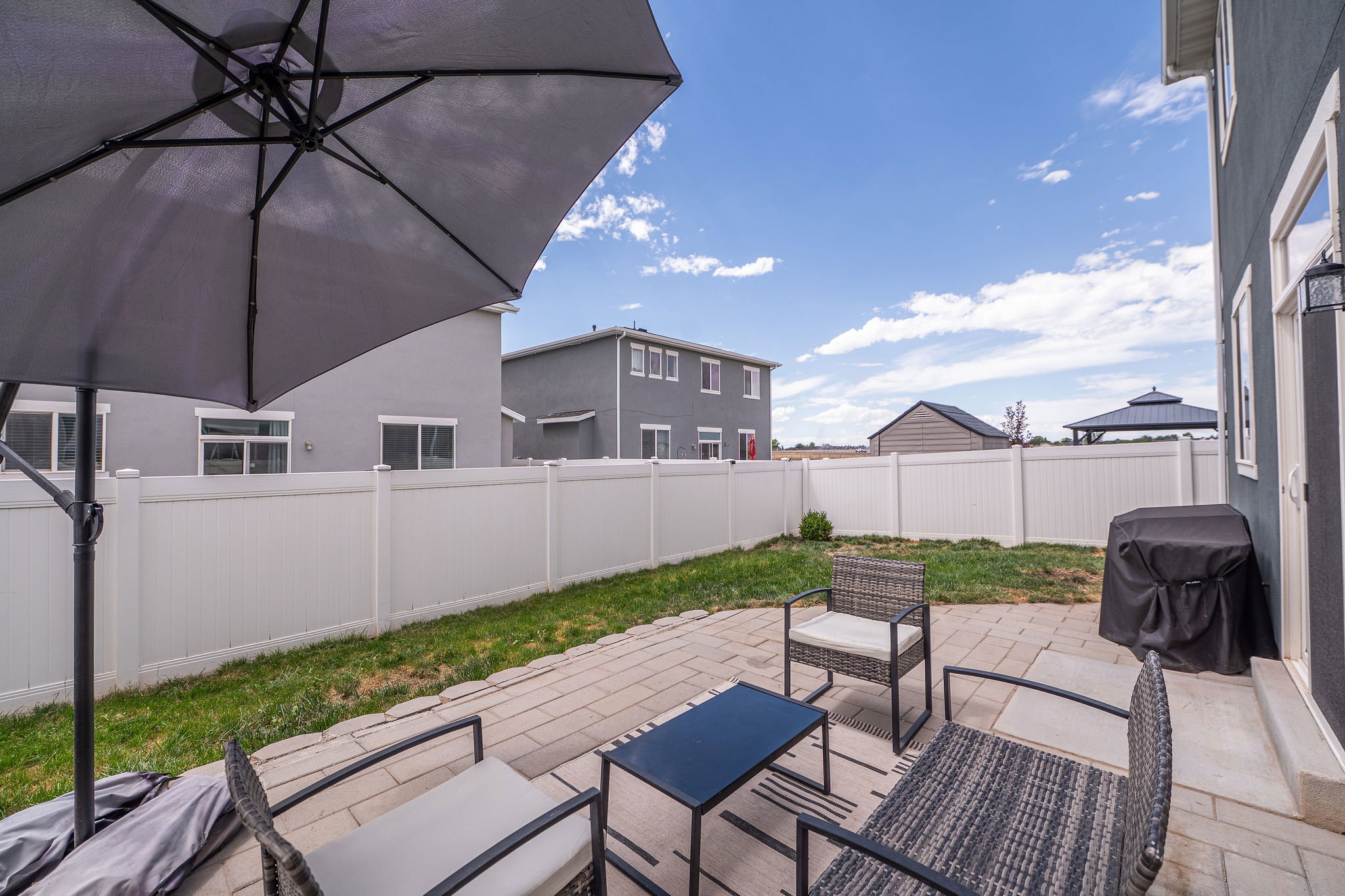 Patio and fully fenced backyard