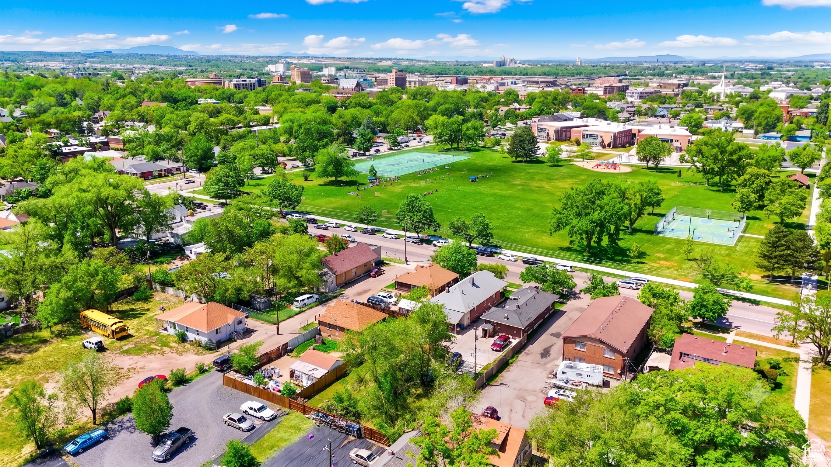 Aerial perspective showcasing a verdant neighborhood with mature trees