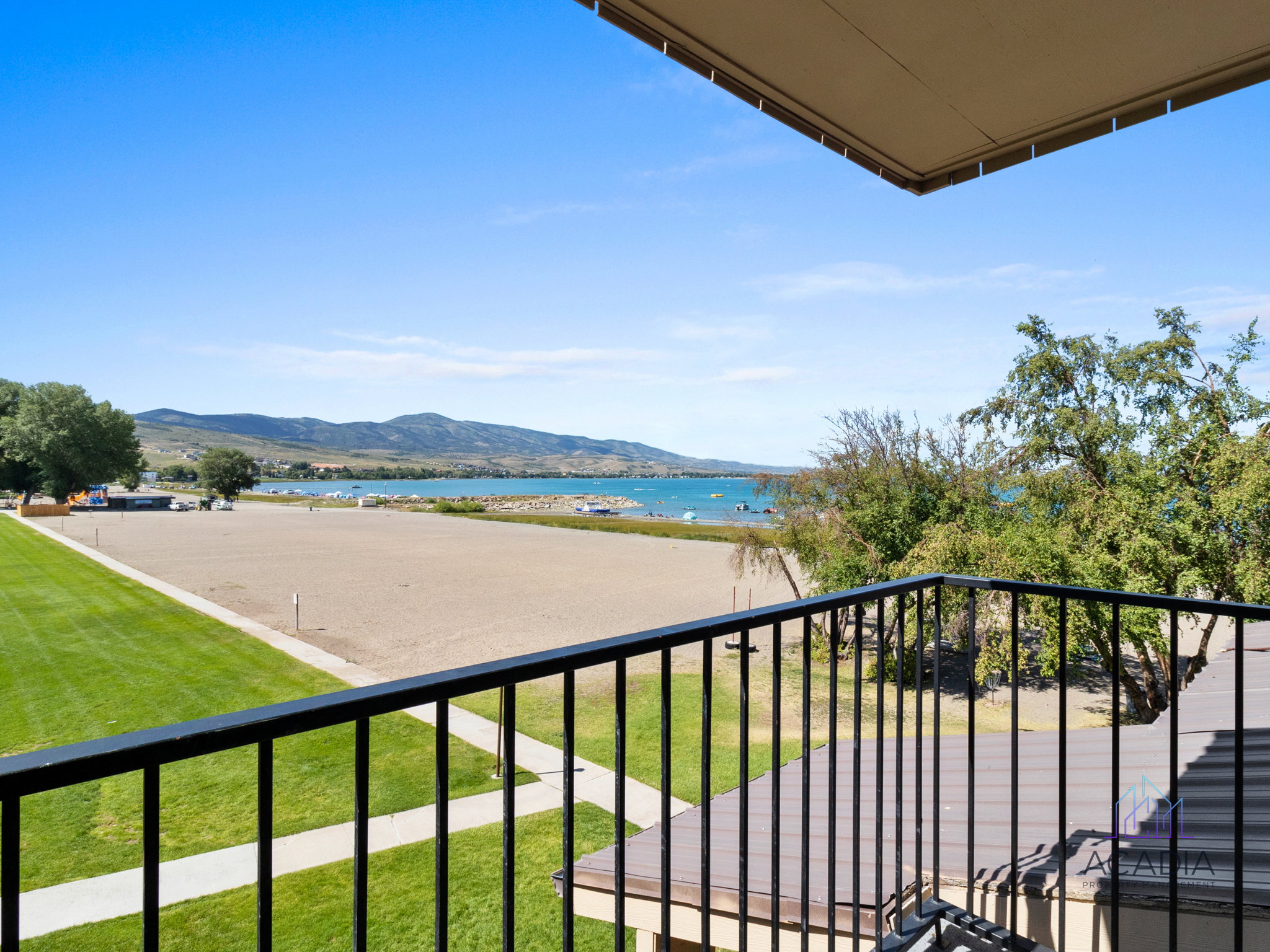 Balcony featuring black metal railings and a clear sky overhead