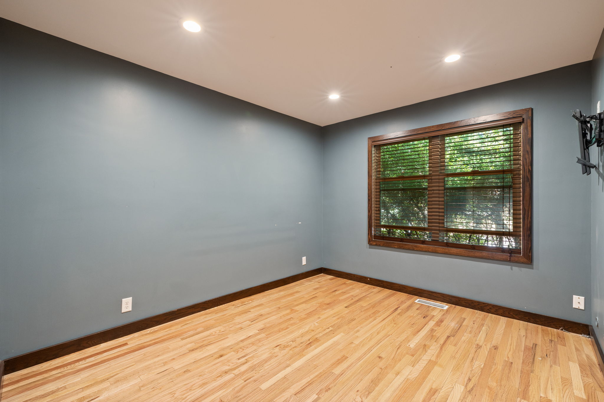 Hardwood flooring throughout featuring recessed lighting