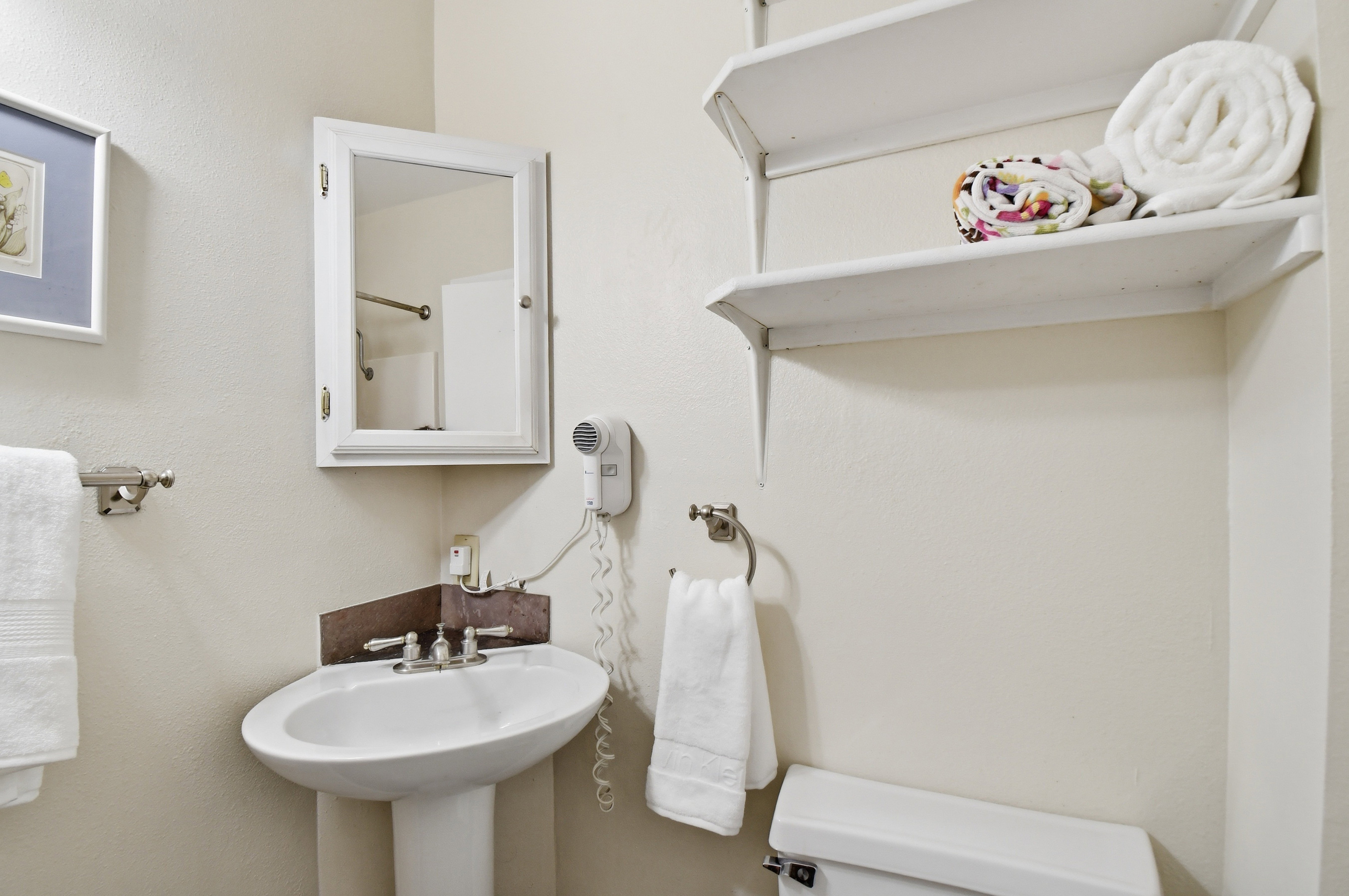 Pedestal sink with dual-handle faucet