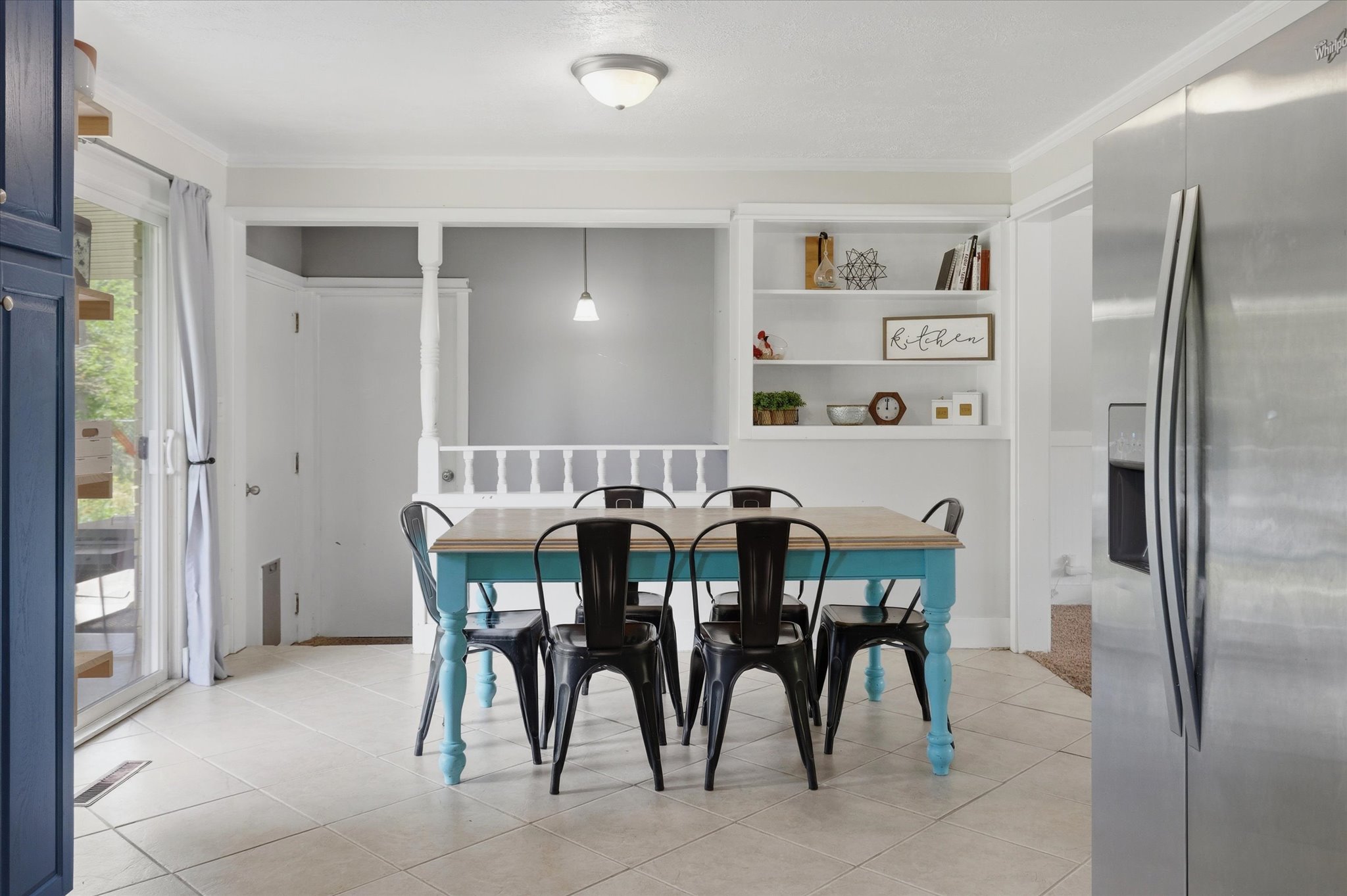 Dining area with light-toned tiled flooring