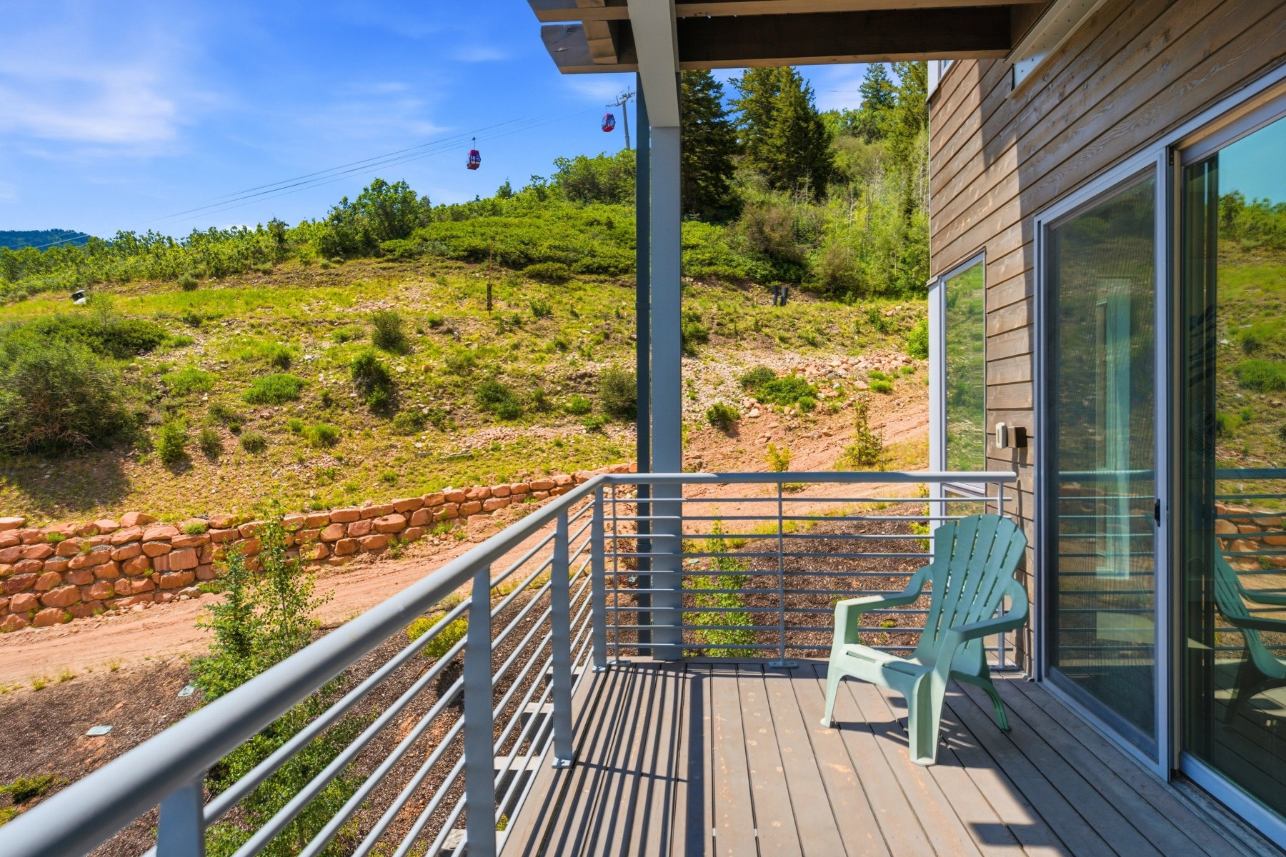 Expansive outdoor deck featuring composite decking and modern metal railings