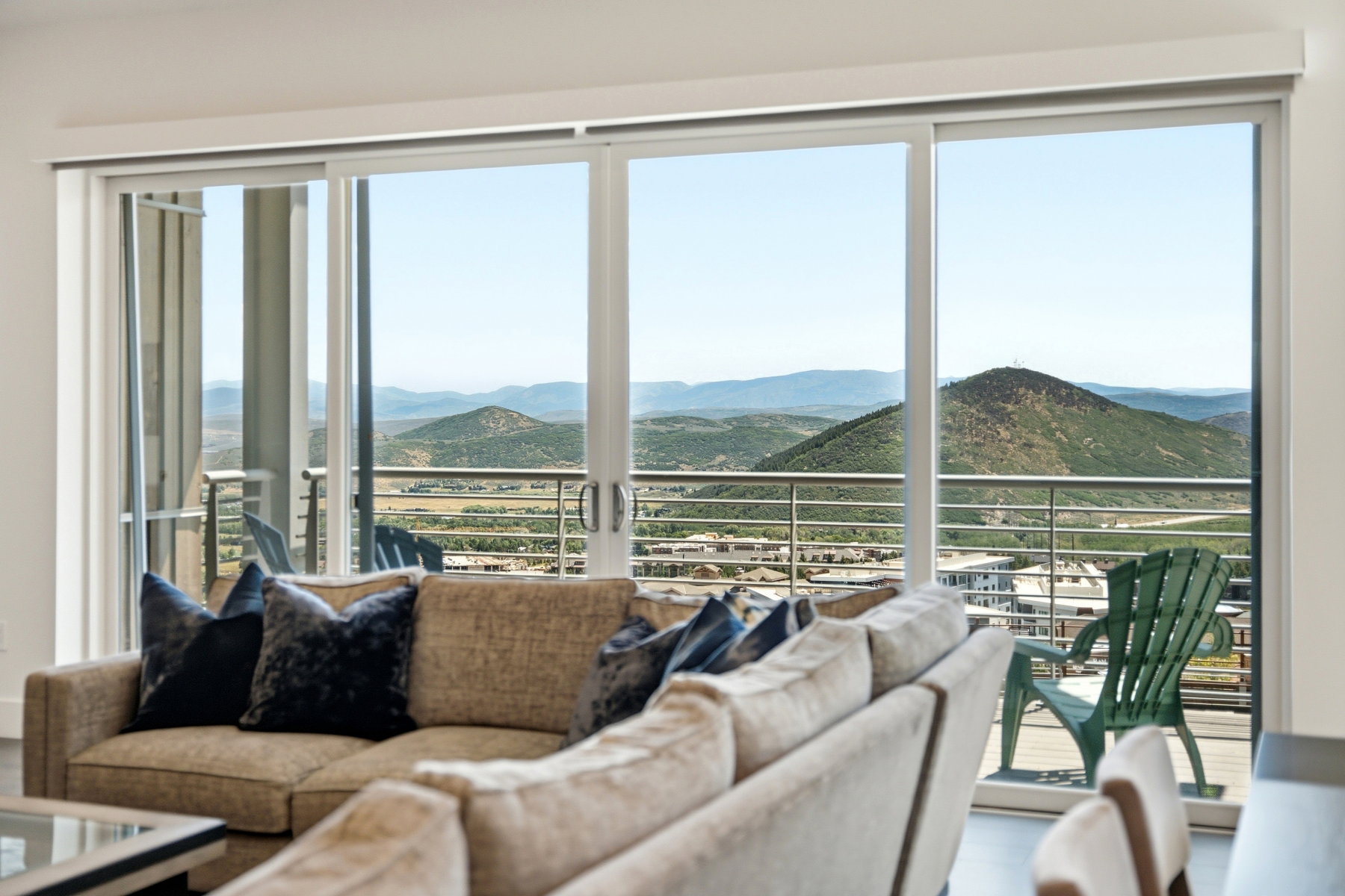Sliding glass doors opening to an exterior balcony with metal railings