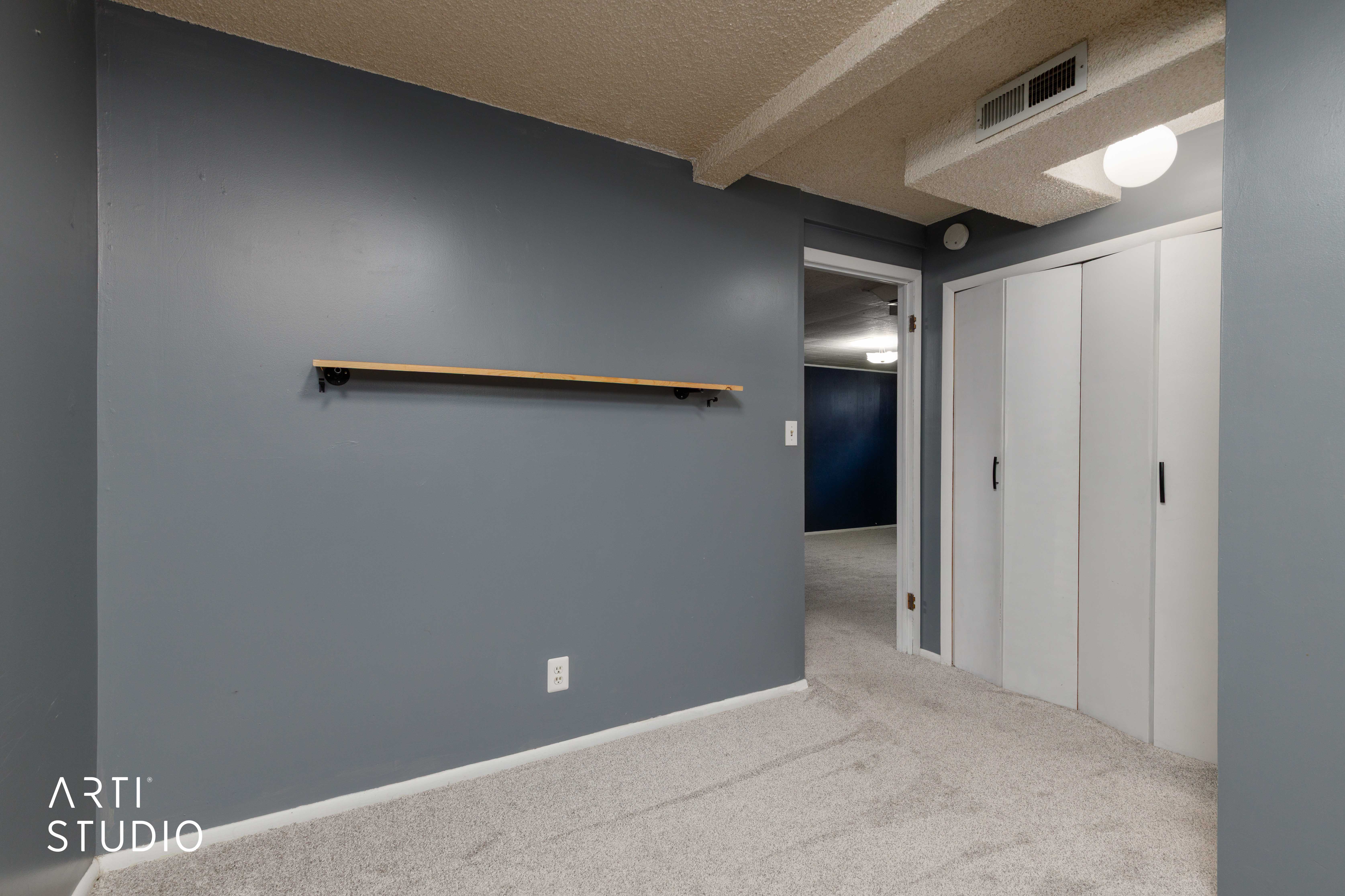 Wall-to-wall carpeting and a neutral color palette