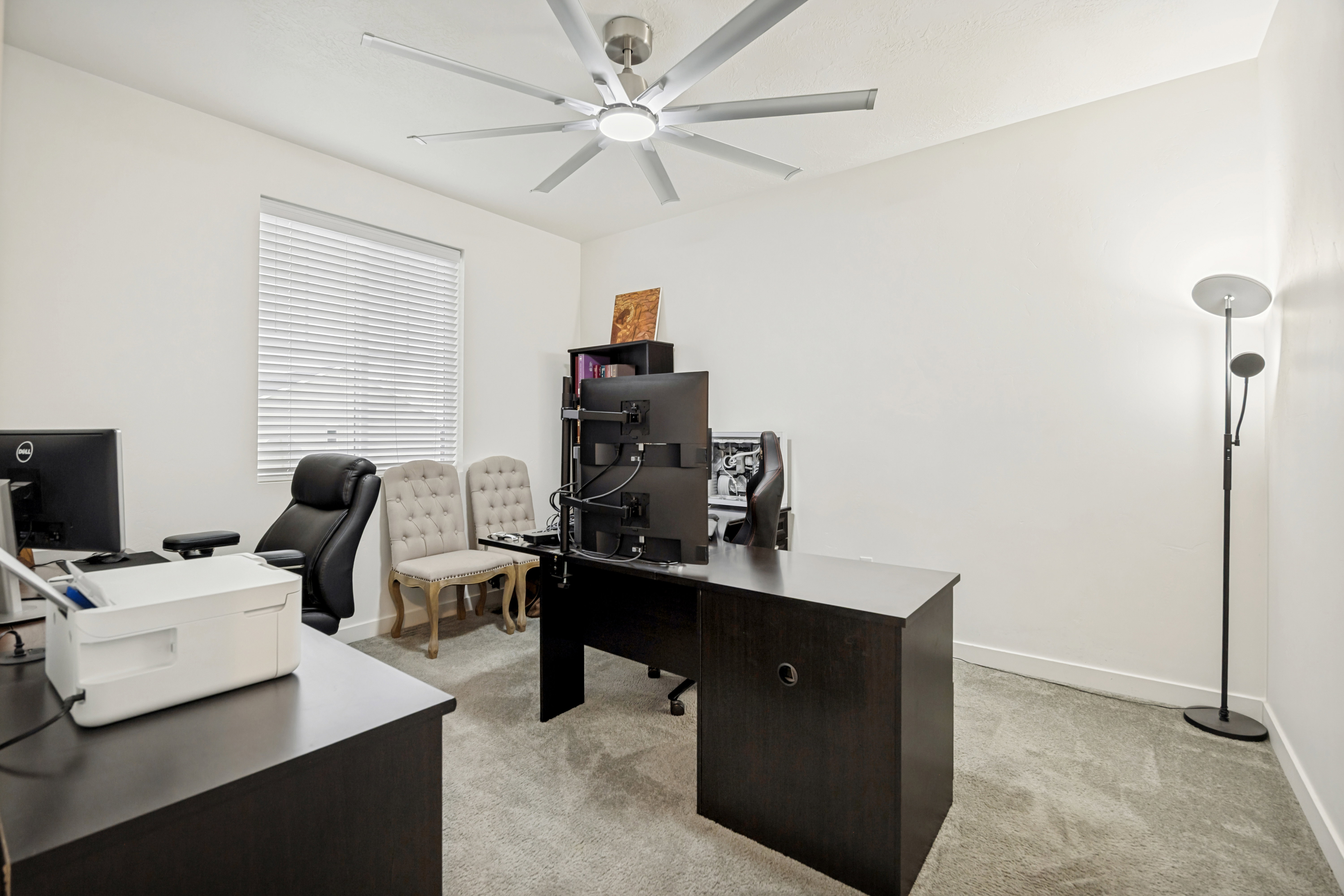 Light gray carpeting complements the bright white walls and ceiling