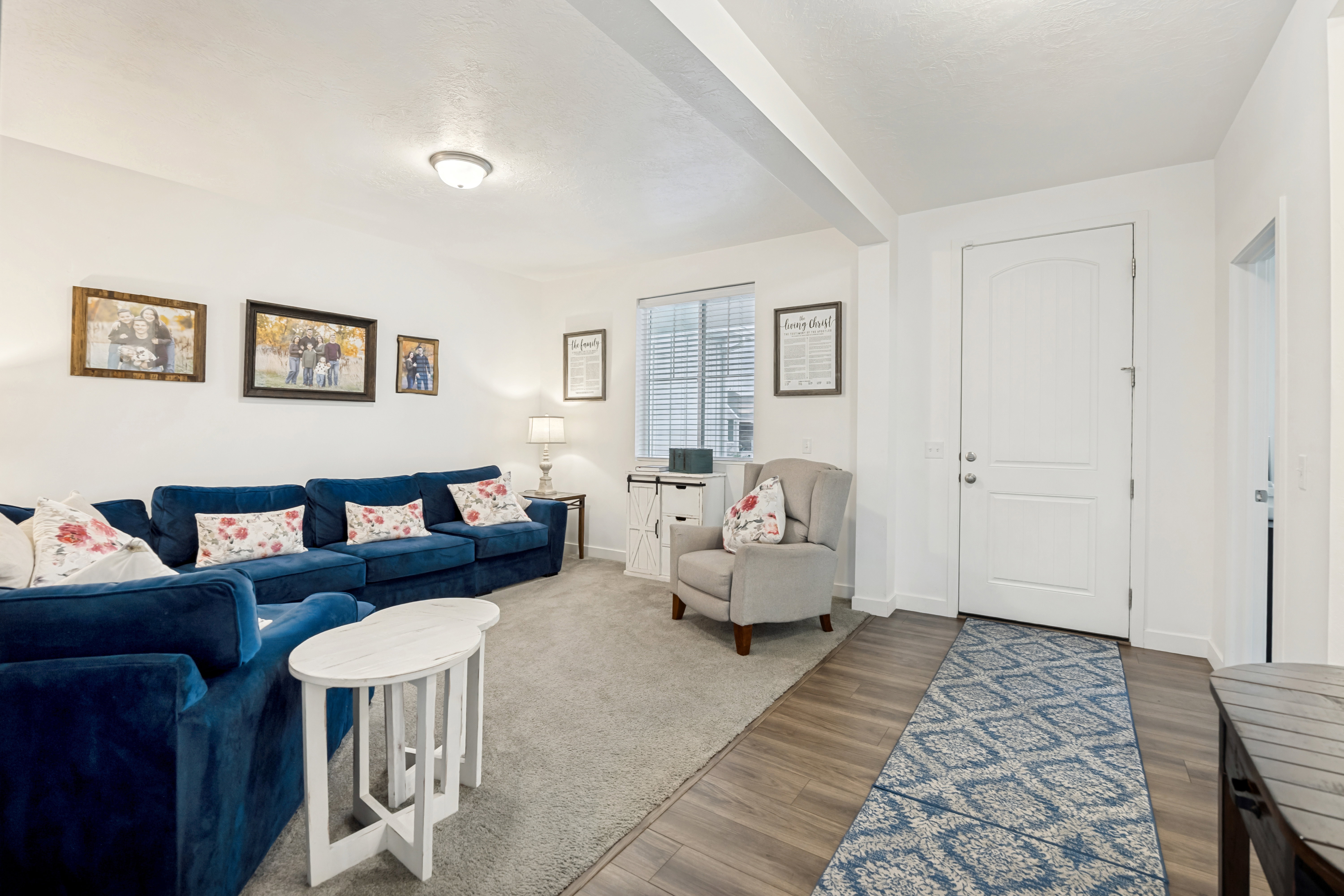 Welcoming entry space featuring wood-finish flooring, a white paneled door, and a recessed ceiling light