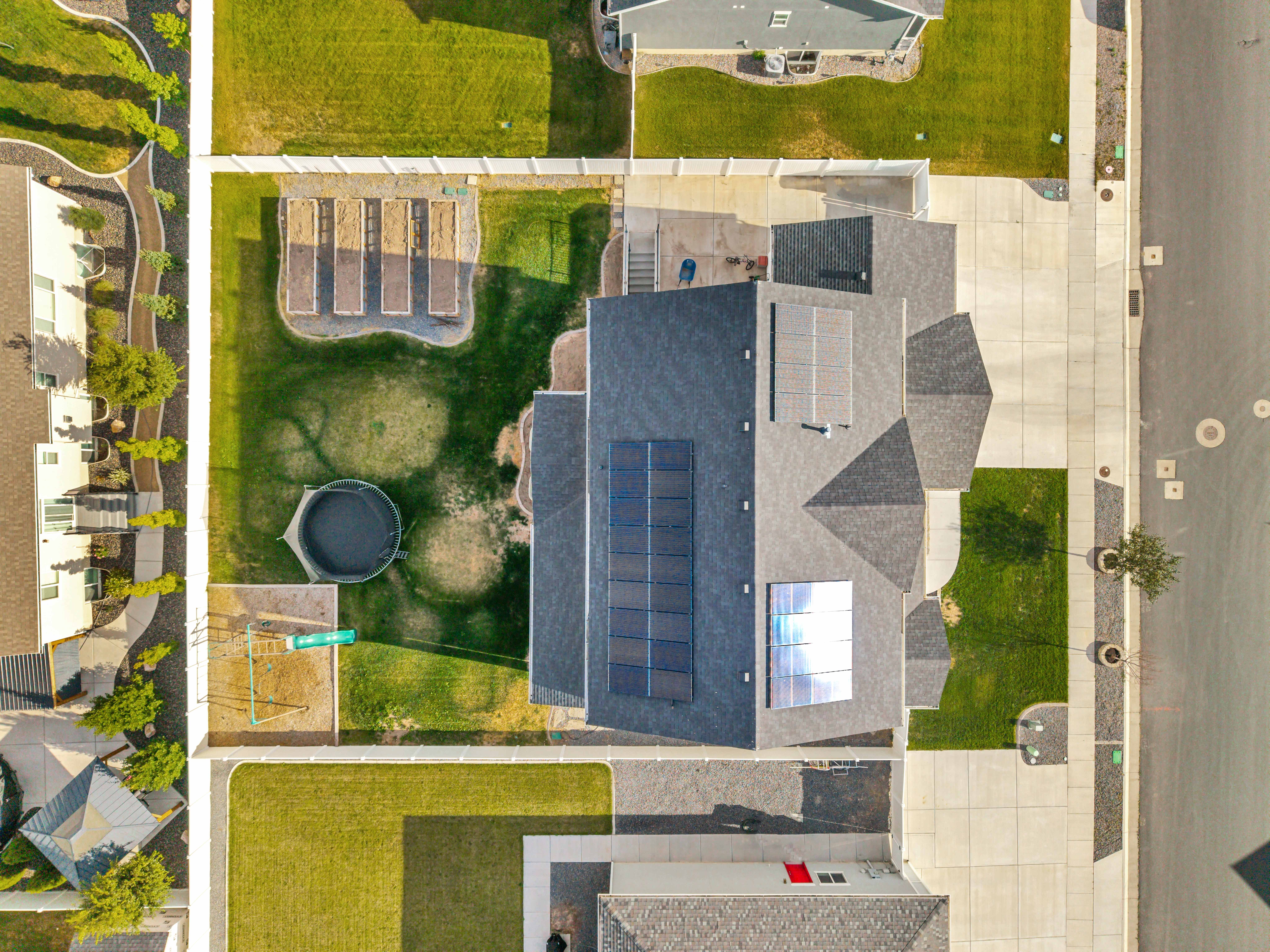 Expansive property featuring a multi-gable roofline with visible solar panel arrays