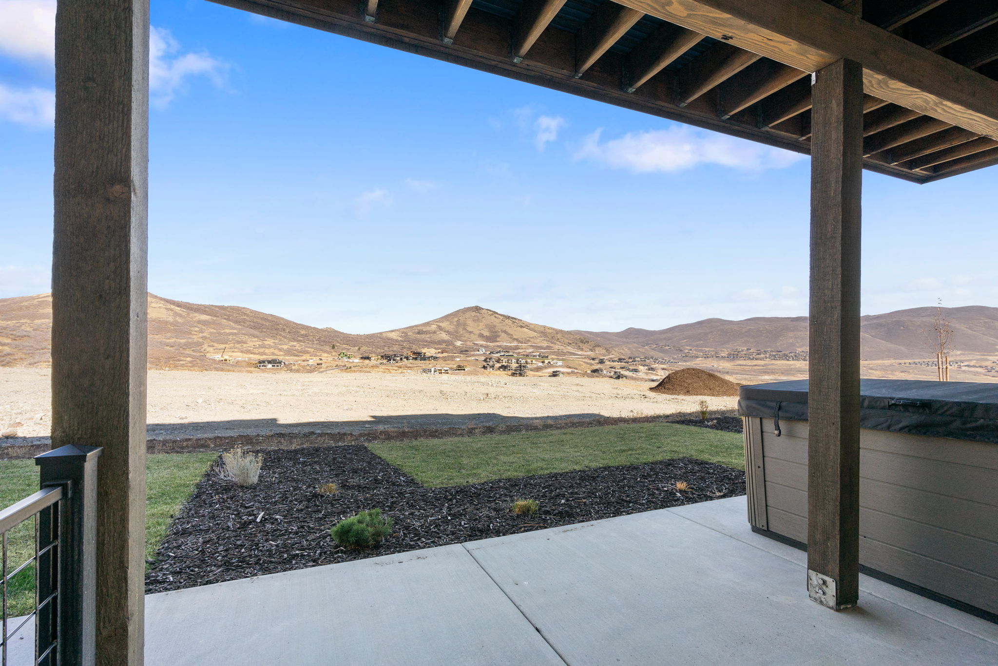 Expansive concrete patio with mountain scenery