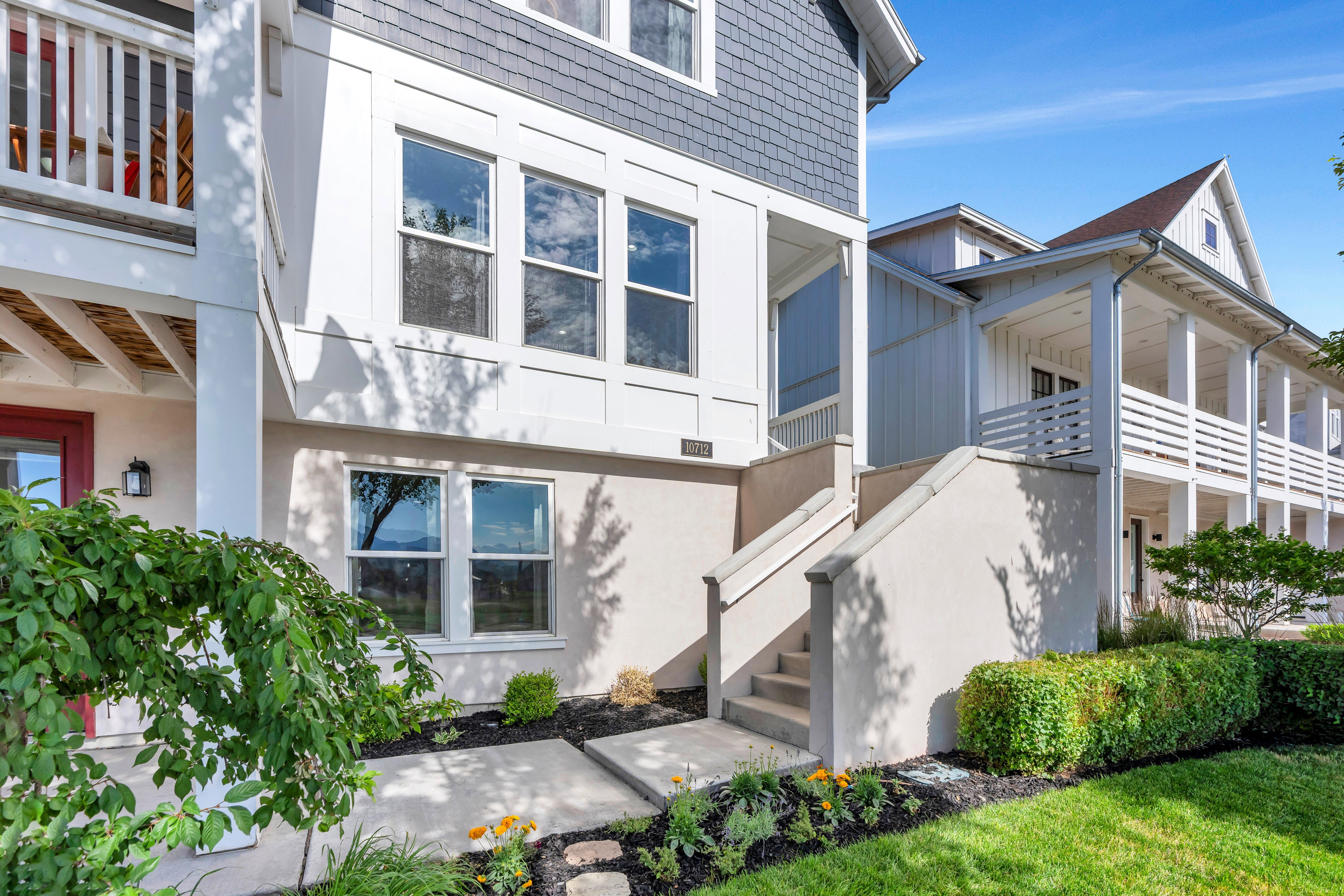 Modern exterior featuring a combination of horizontal siding, shake siding, and stucco finishes