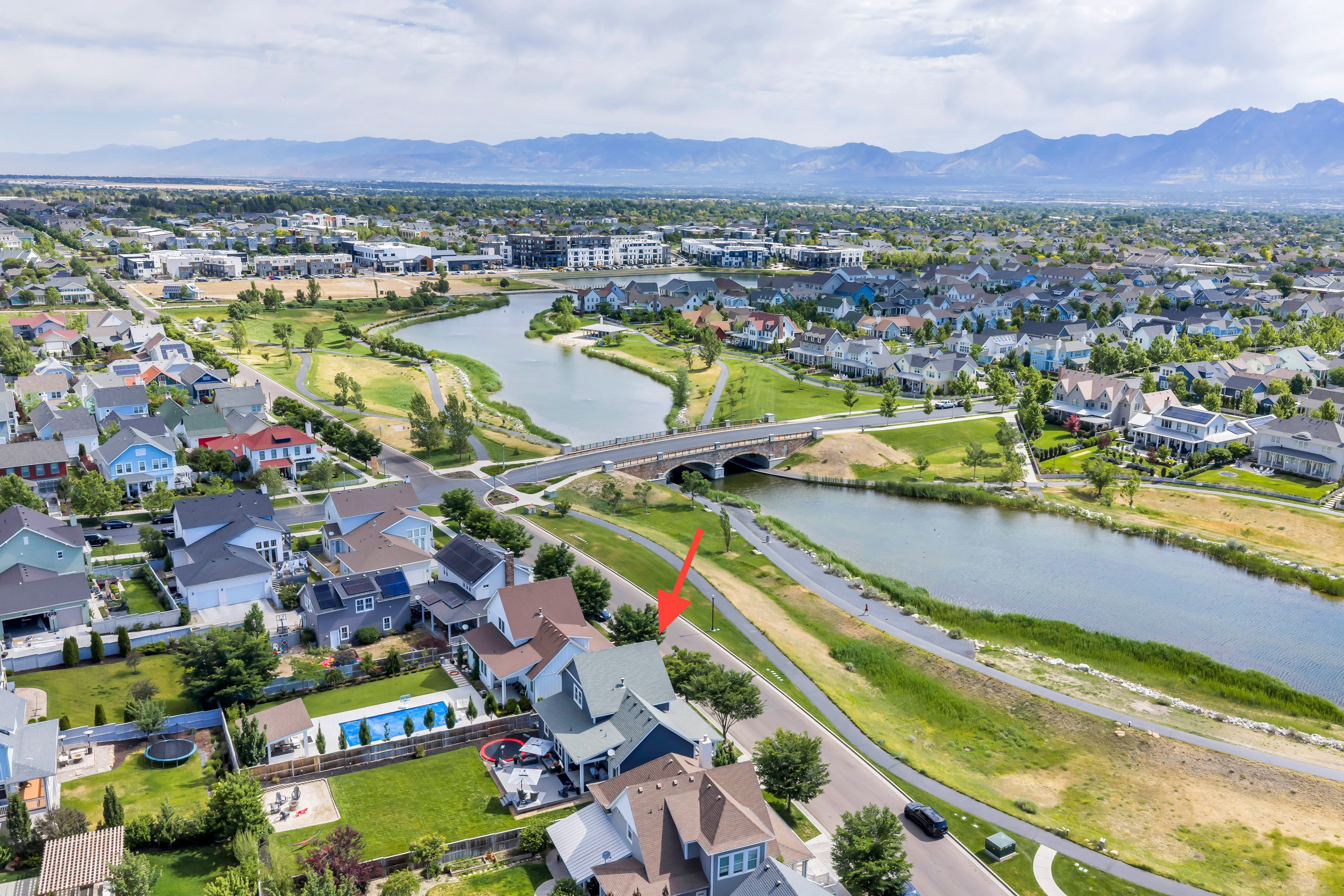 Aerial perspective showcasing a residential neighborhood with mountain backdrop