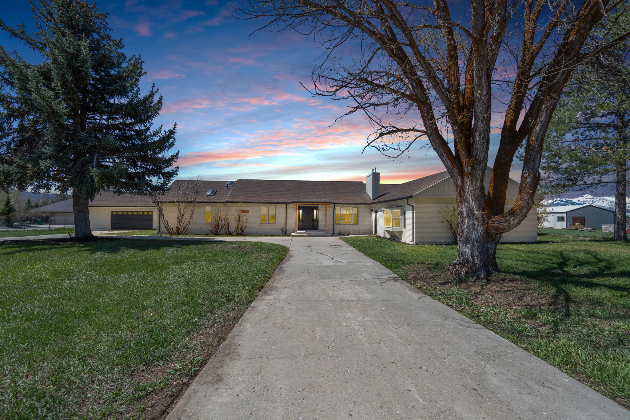 Single-story residence featuring a concrete driveway and an attached two-car garage