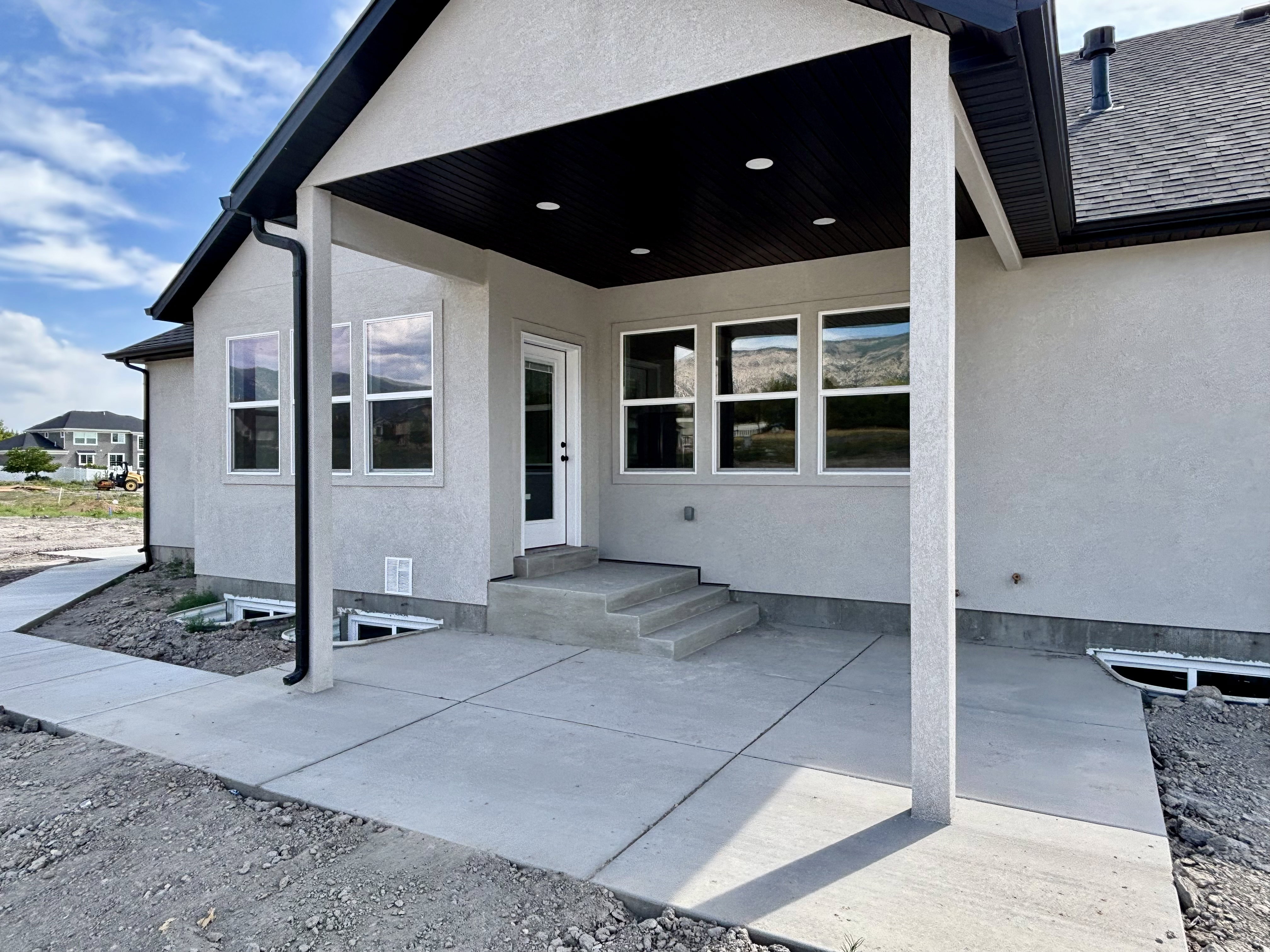 Covered patio featuring recessed lighting. Walkway from RV pad to covered patio