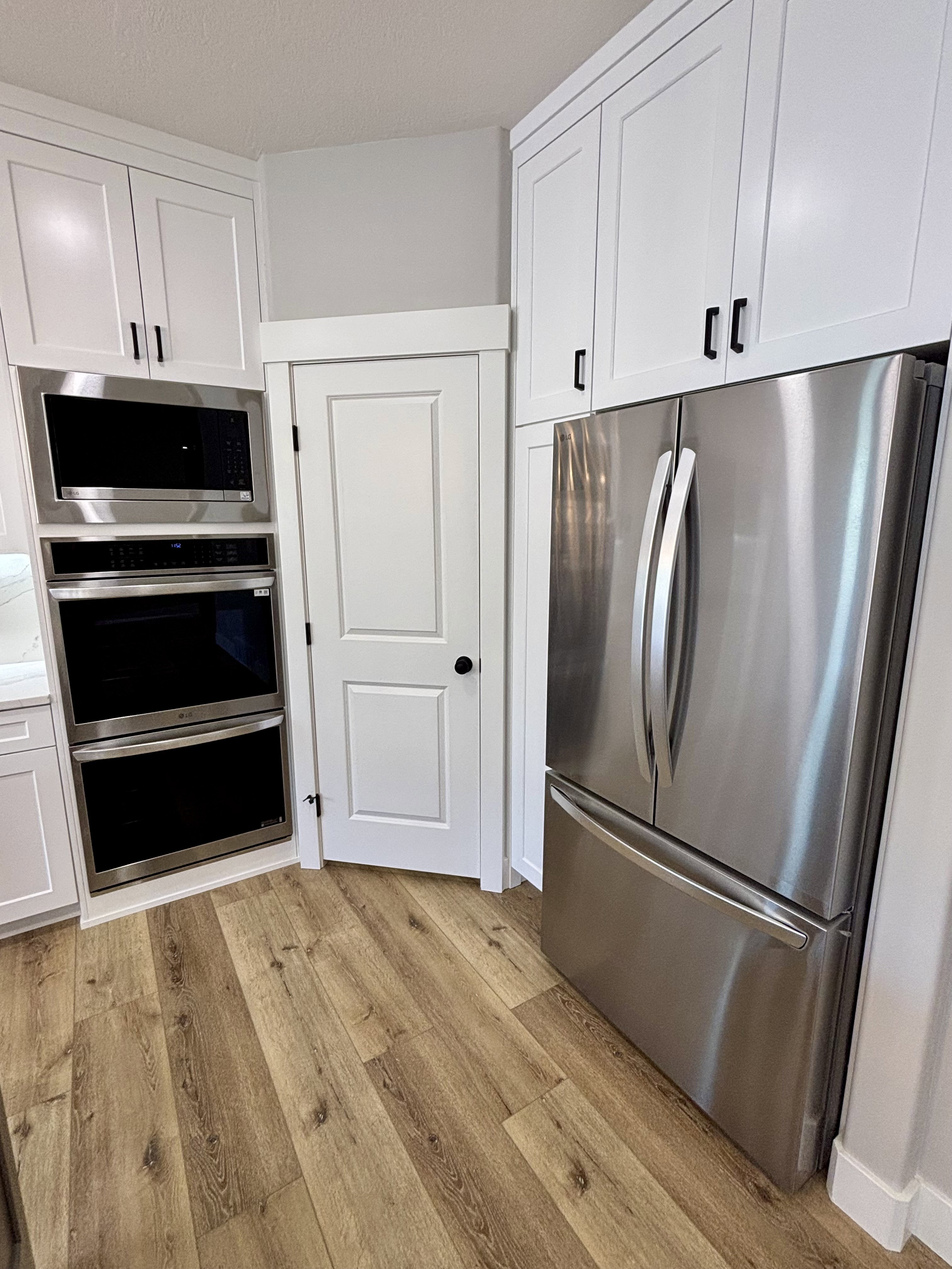Stainless microwave, double ovens and refrigerator