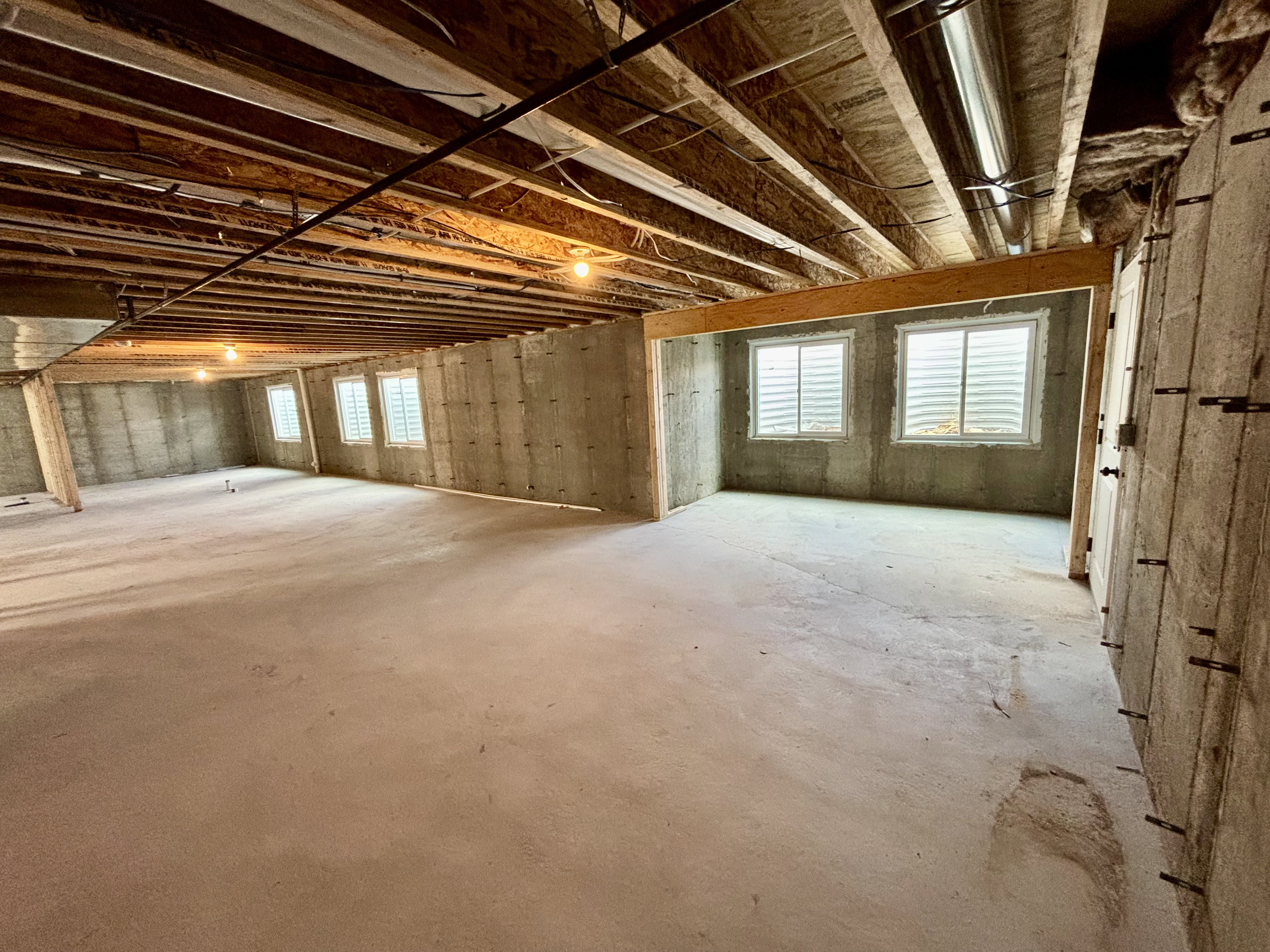 Unfinished basement, potential kitchen and dining area