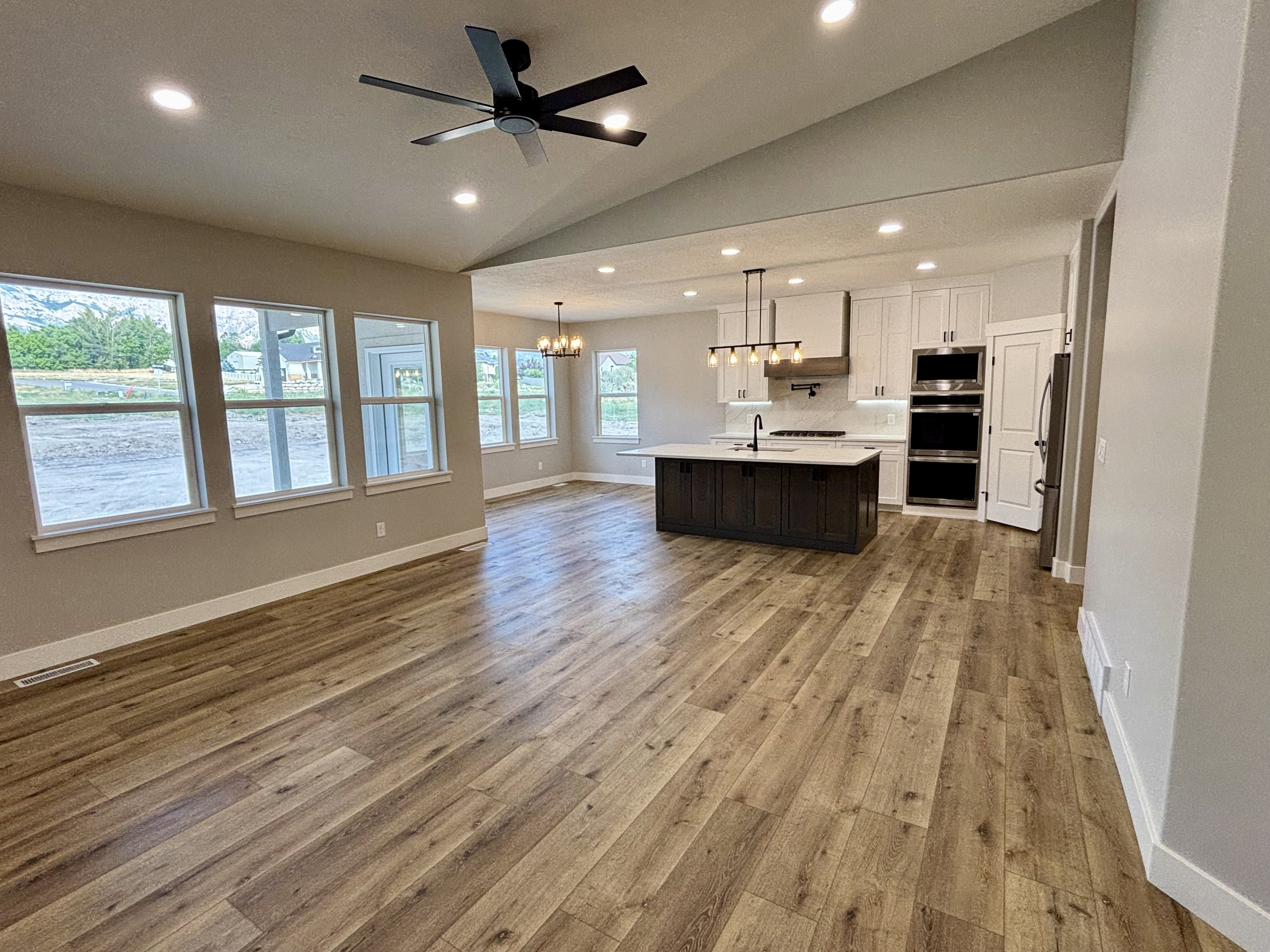 Open-concept, view of kitchen and dining area from the great room