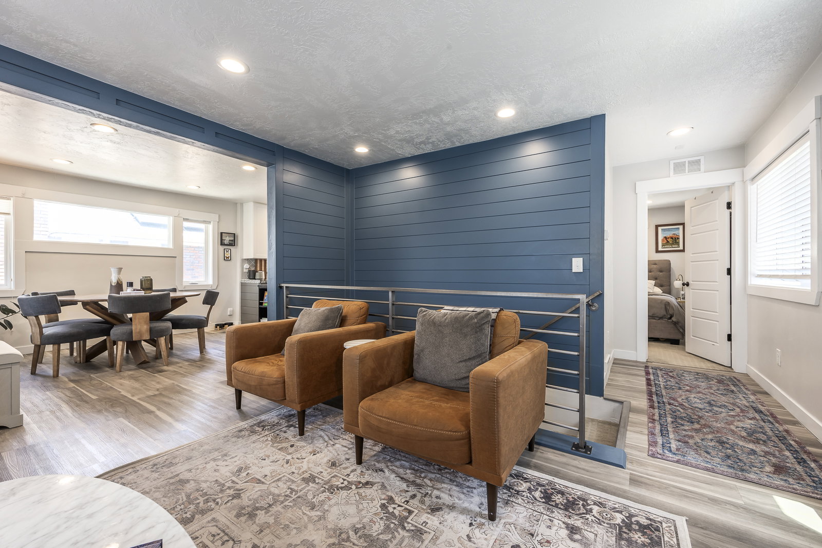Open-concept common area featuring wood-finish flooring and recessed lighting