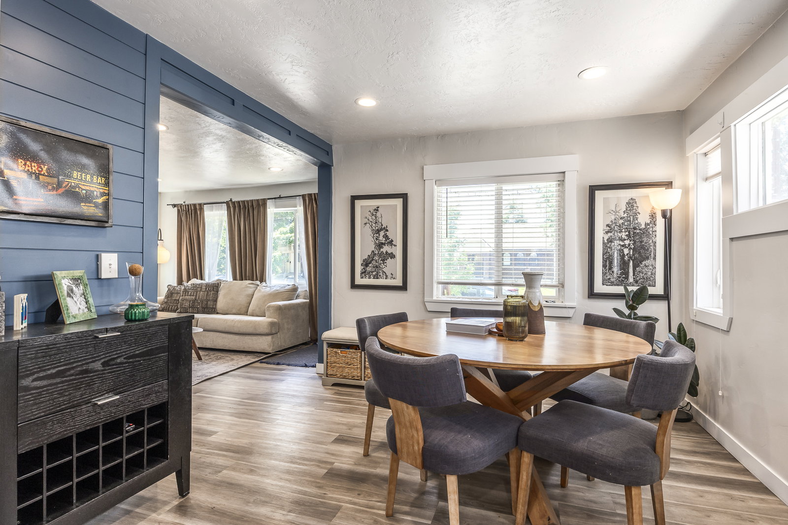 Dining area featuring wood-finish flooring, recessed lighting, and ample natural light from multiple windows