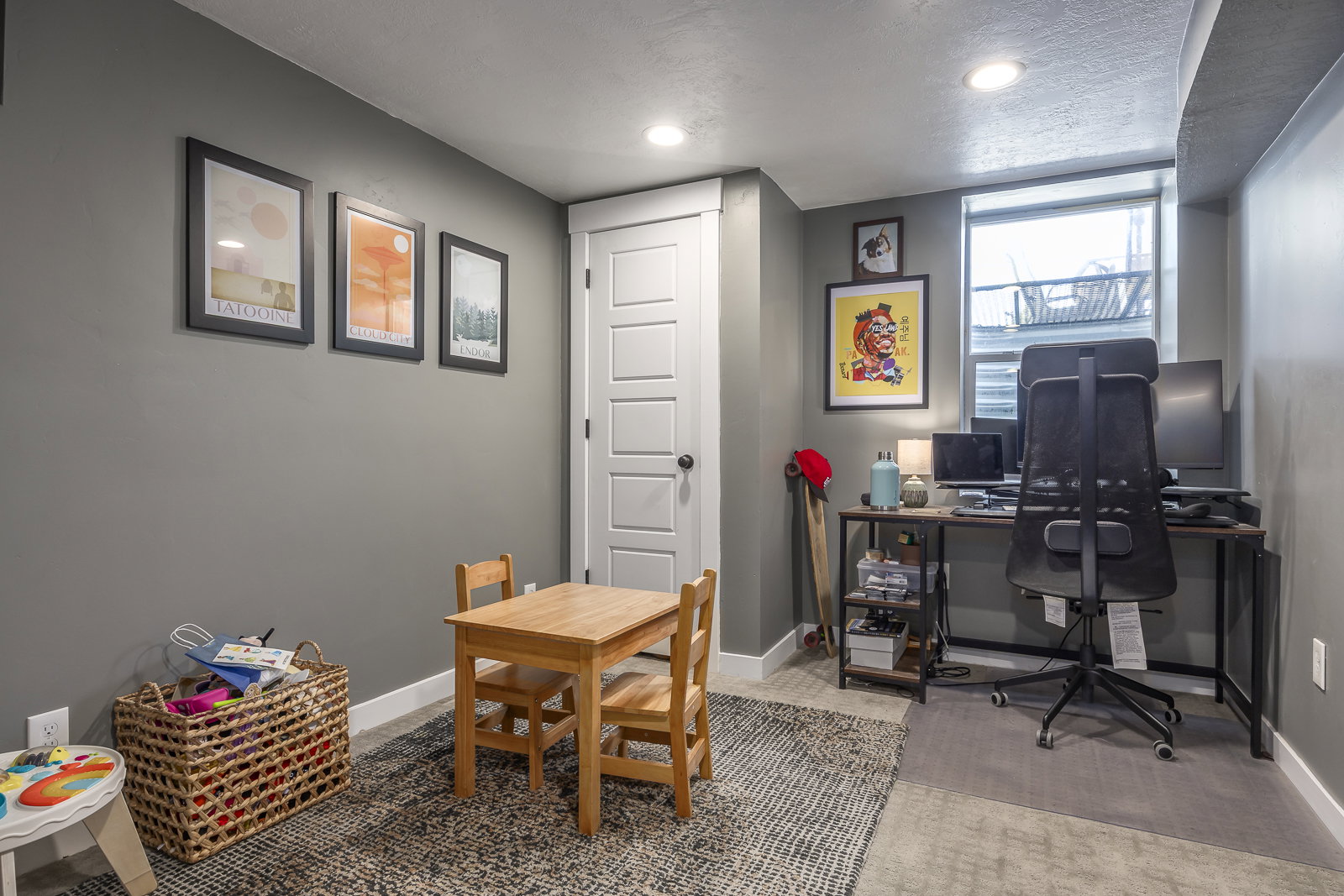 Finished room with recessed lighting, a multi-panel interior door, a window with exterior views, and neutral walls