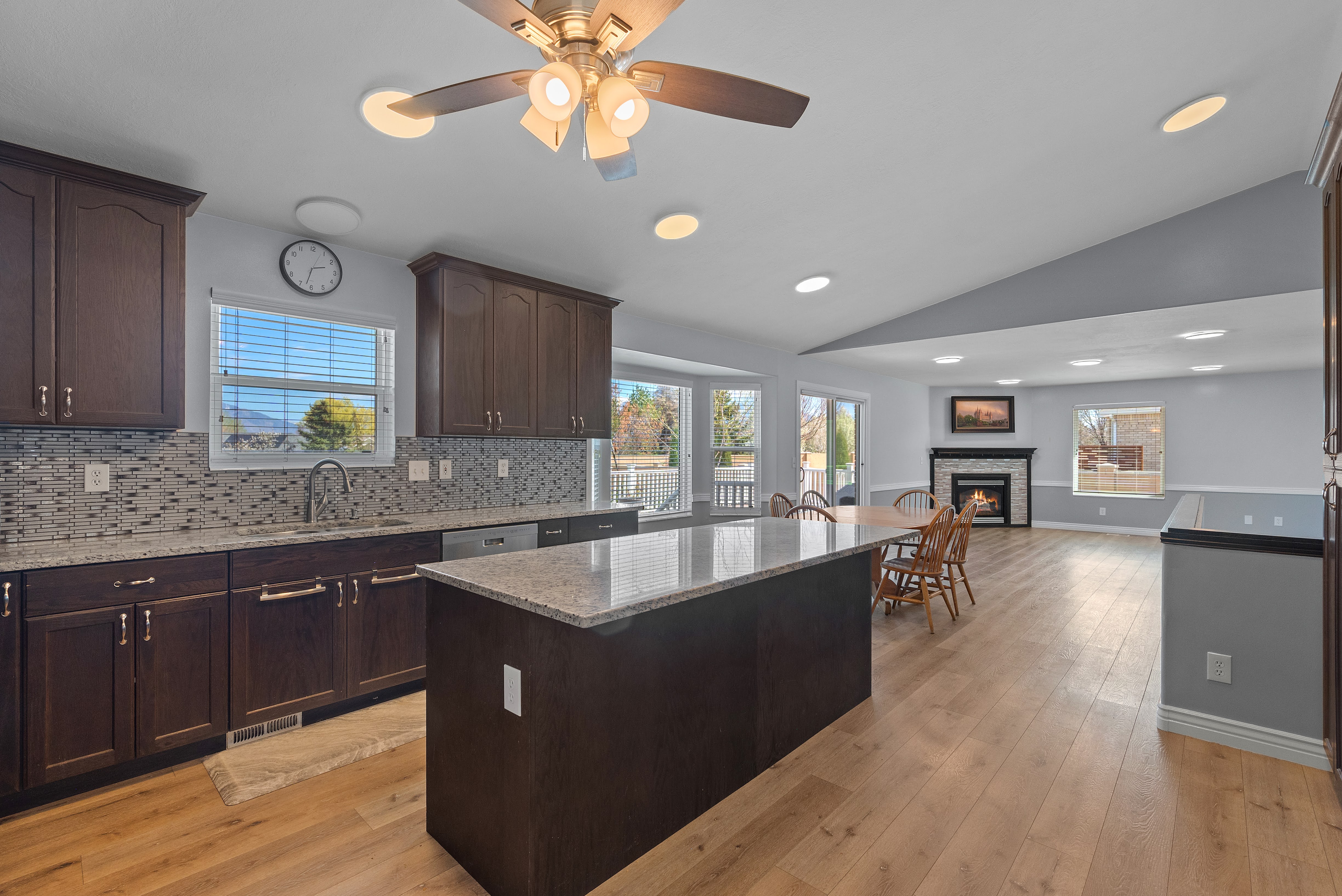 Open-concept living space with wood-finish flooring throughout