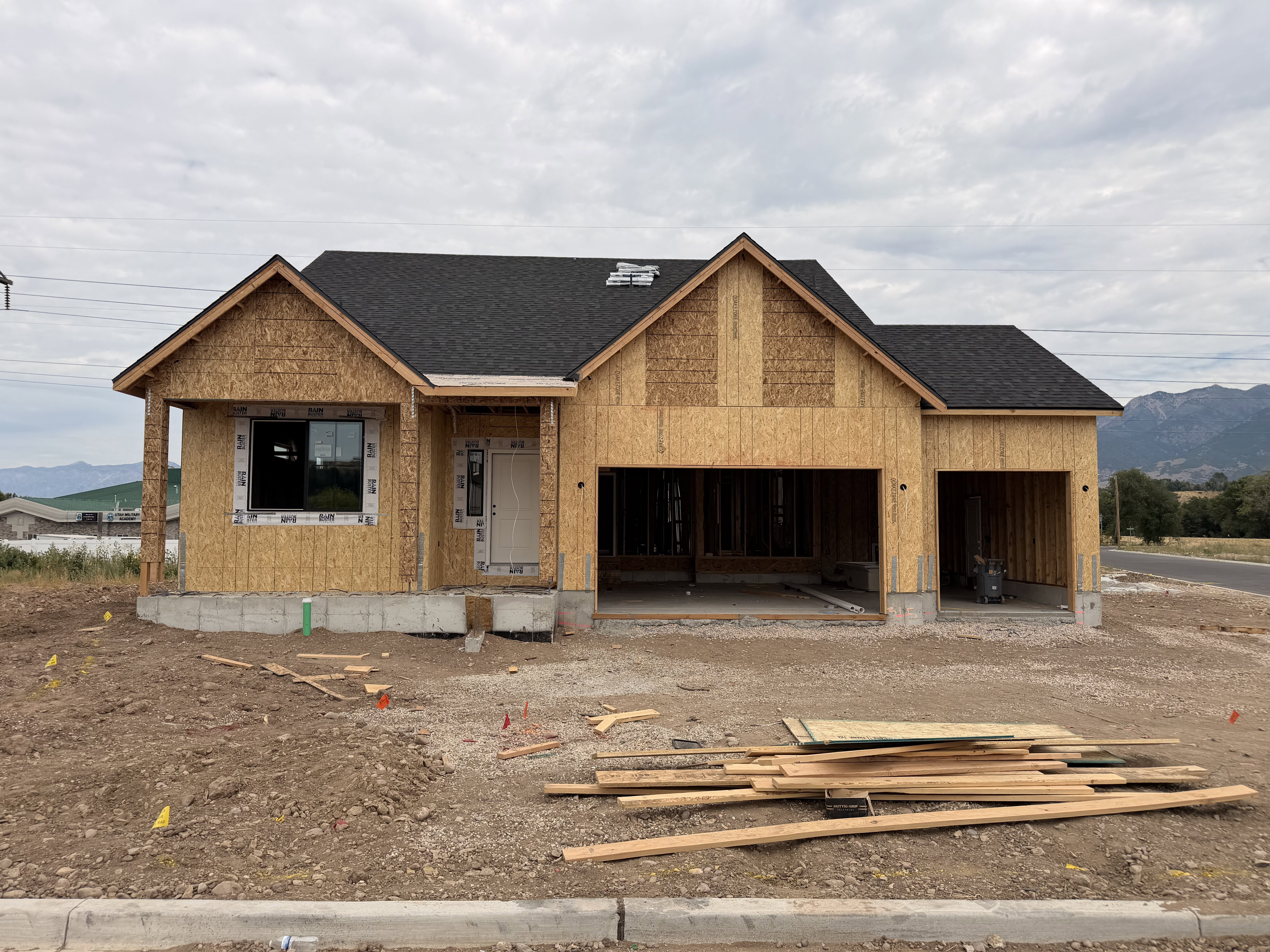 Newly constructed single-story residence framed with oriented strand board siding