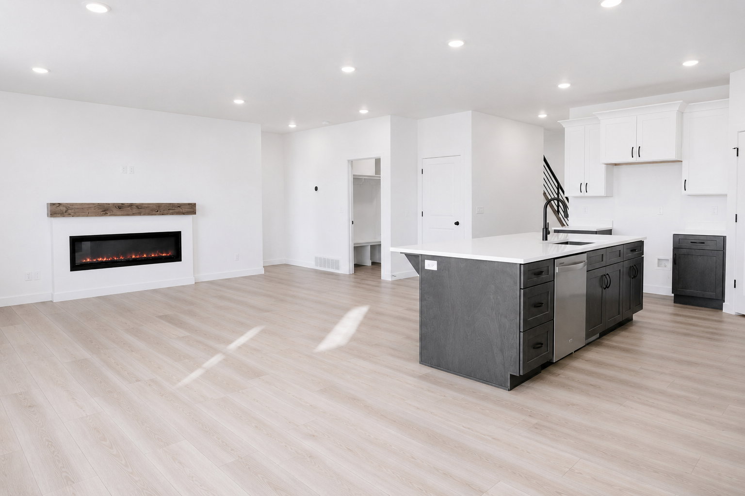 Open-concept living space featuring light wood-finish flooring