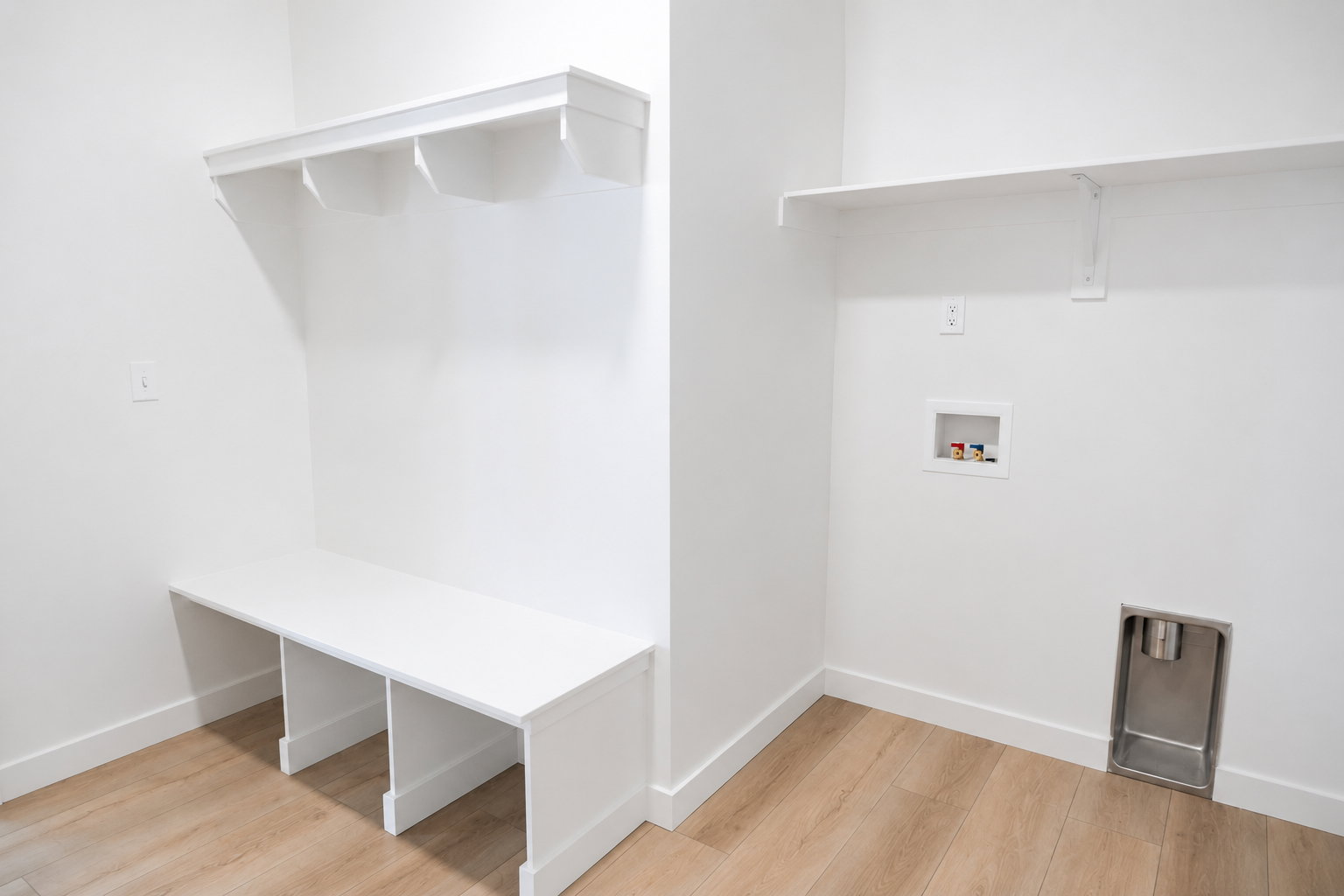 Garage entry/ mudroom featuring a laundry area and wood built-ins