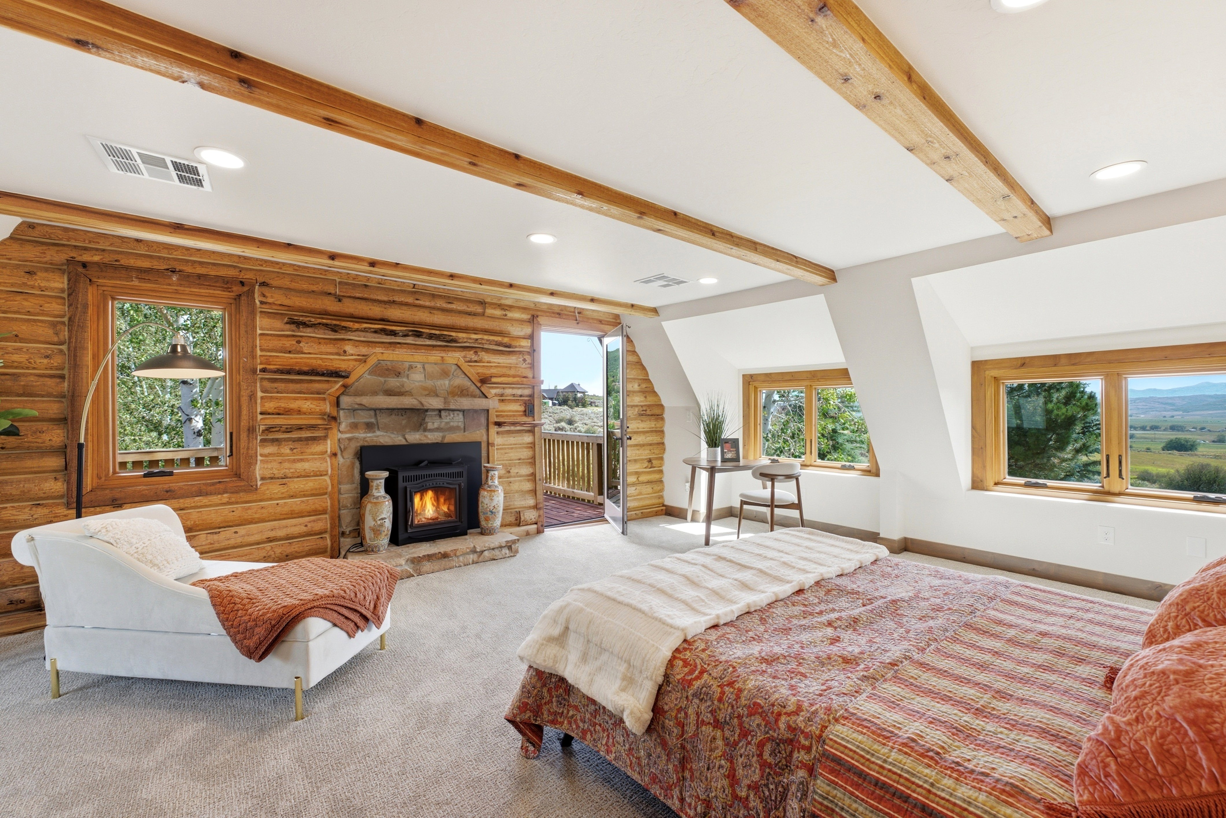 Rustic-inspired interior with wood-finish walls and exposed ceiling beams
