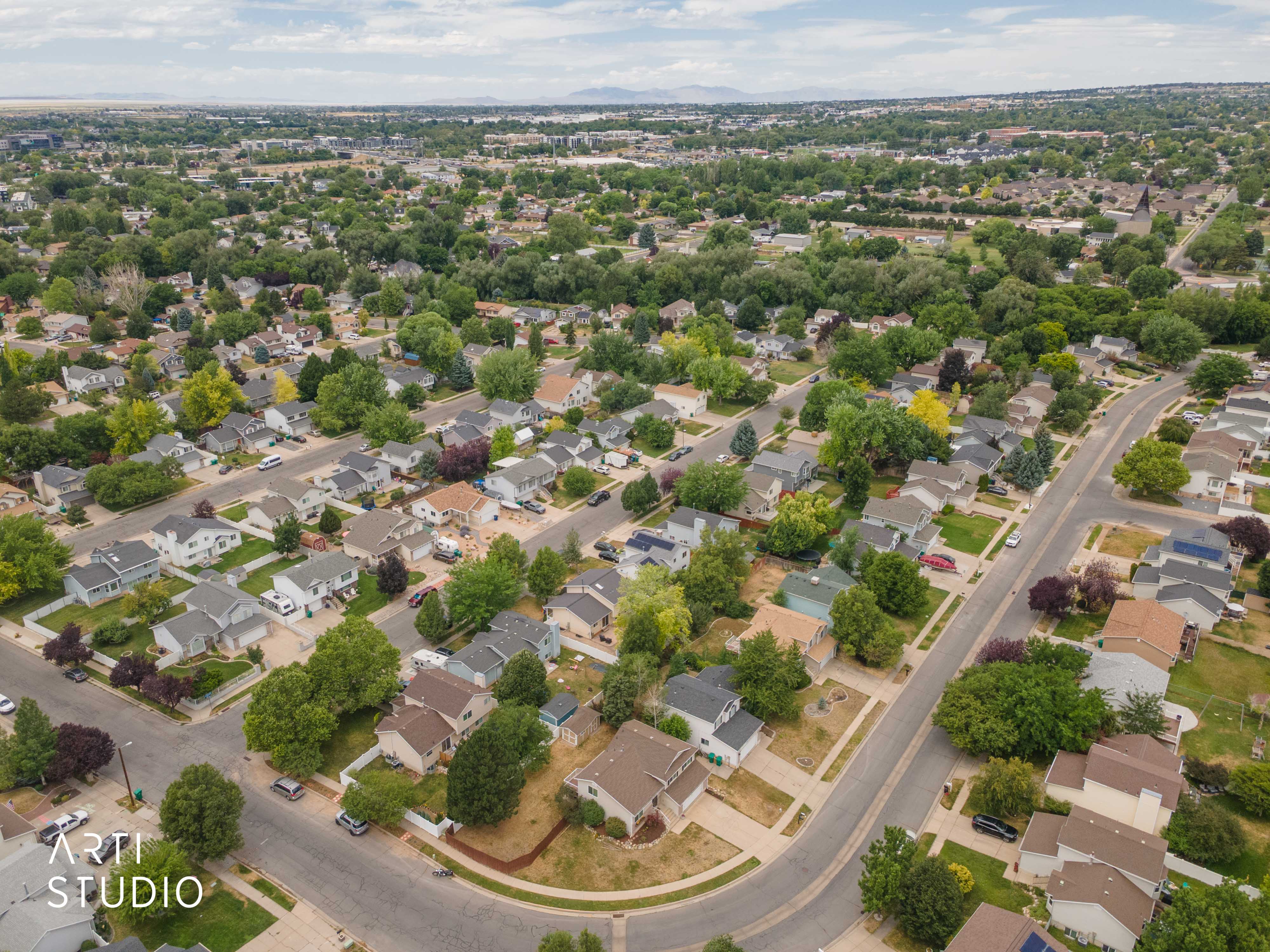 Residential neighborhood featuring a grid of streets and a varied collection of single-family homes